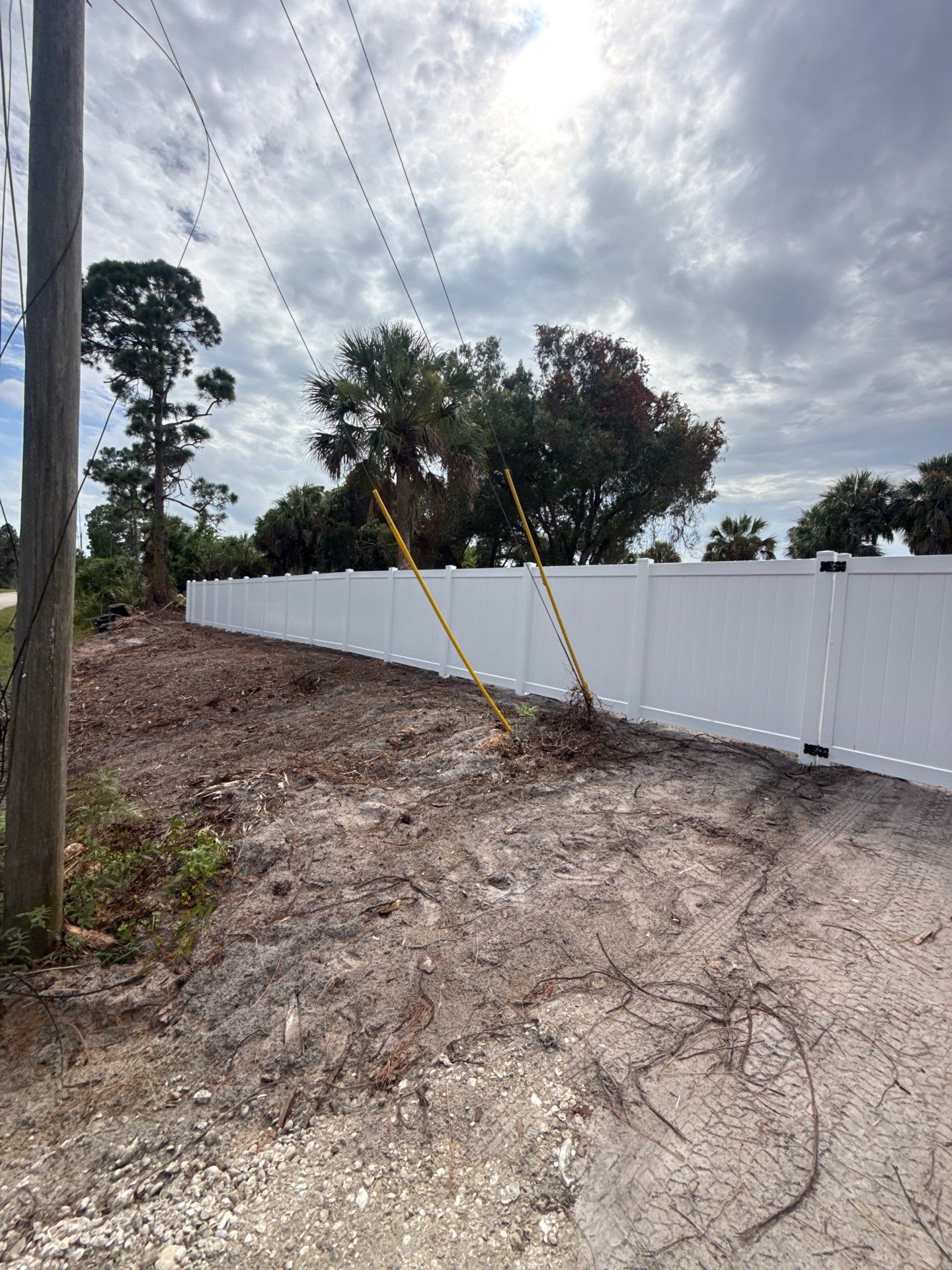 White Vinyl Privacy Fence Installation in North Port Florida by True Fence LLC