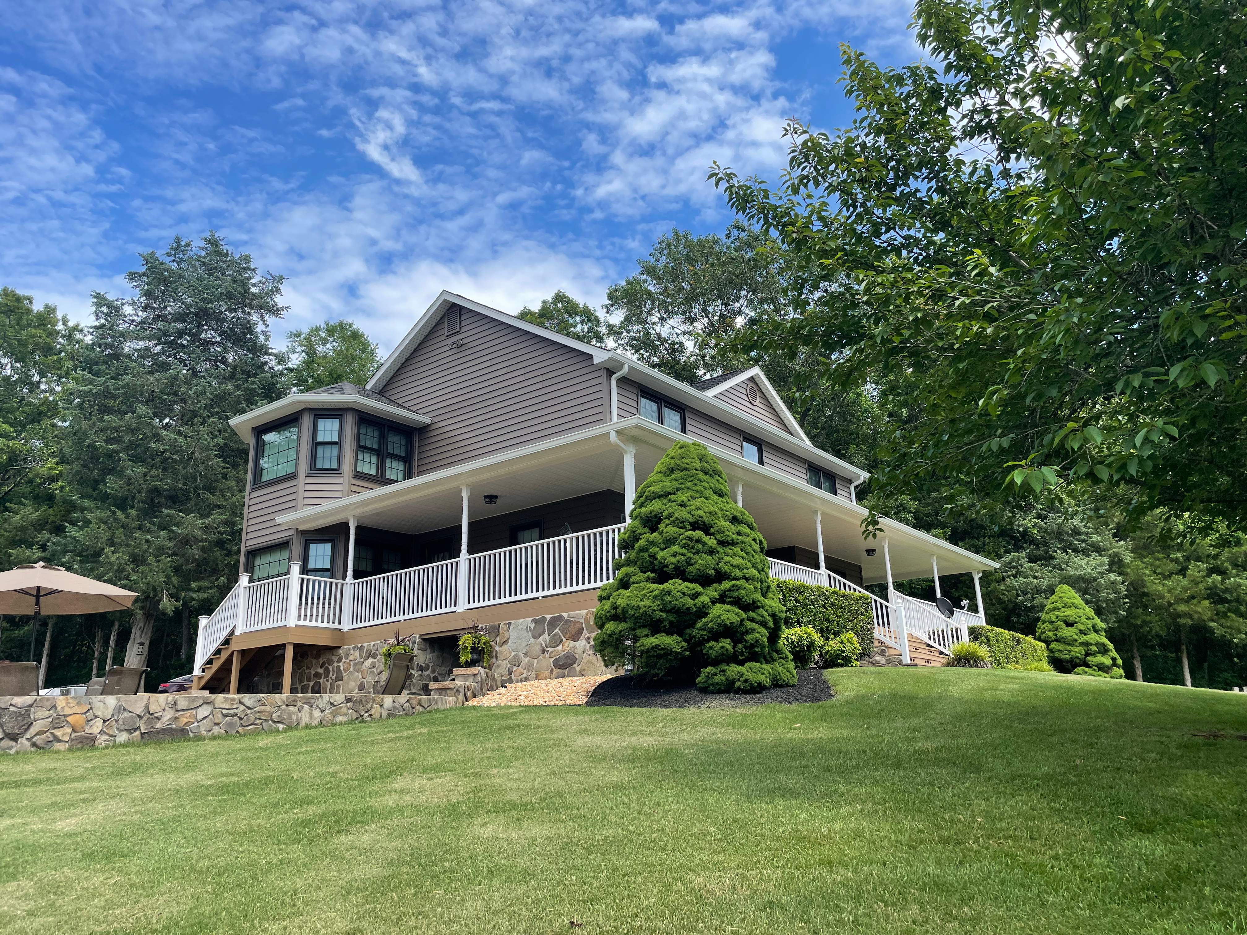 Exterior remodel including window replacement by American Home Contractors