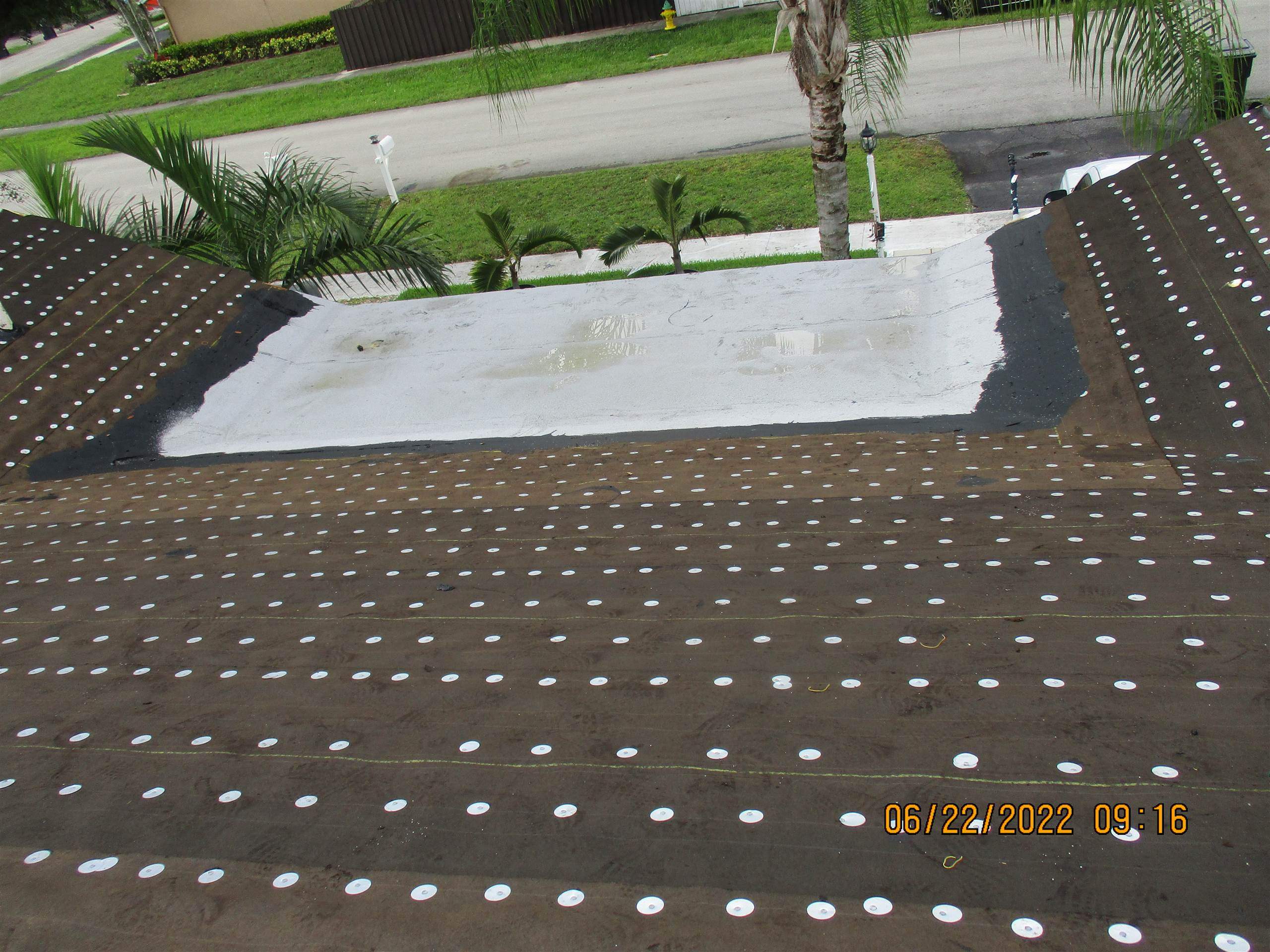 Residential Roofing Installation using 1.5" Nail Strip 24ga Solar White Kynar Coated Standing Seam Metal Panels by Morton Roofing, Inc.