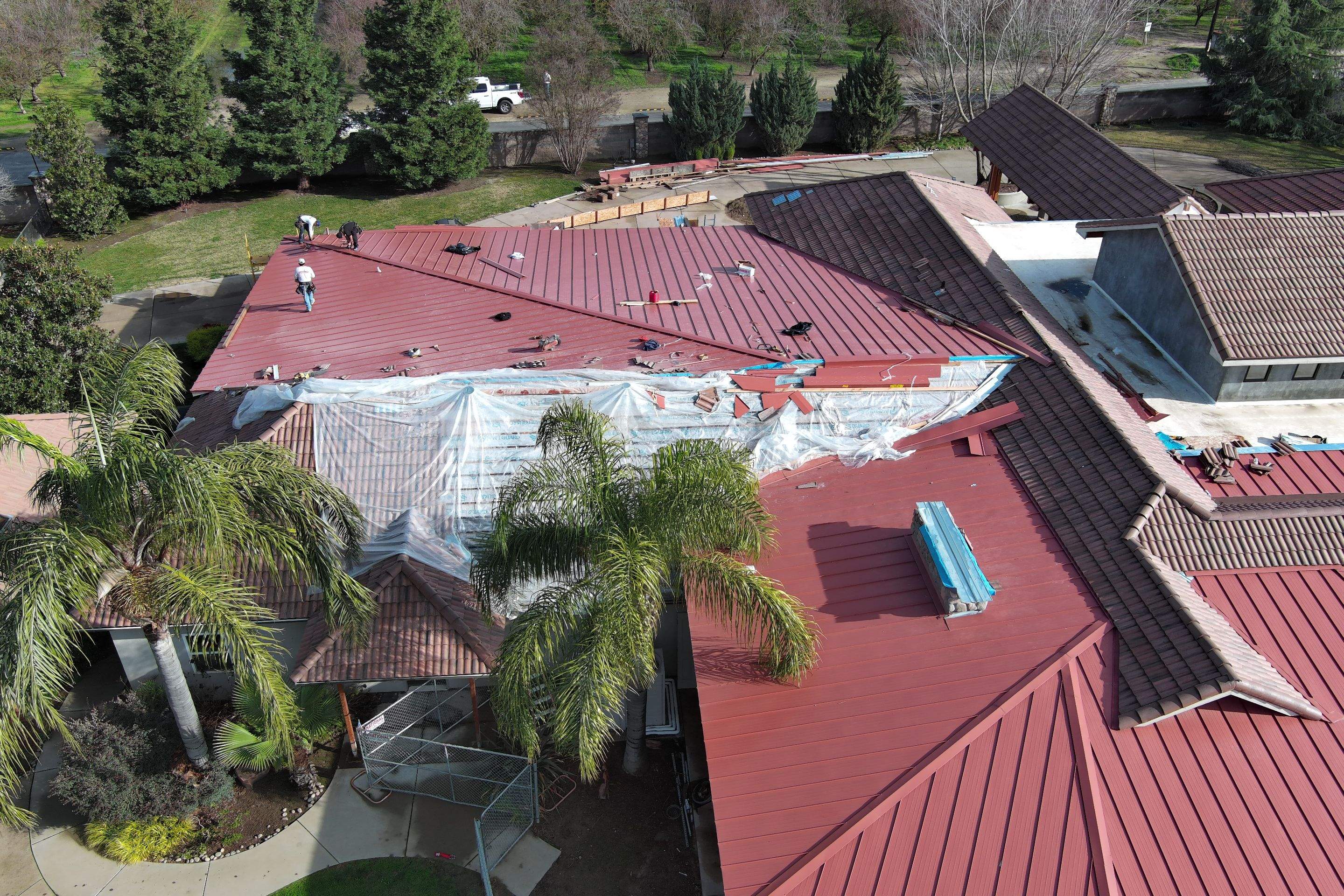 Tile, Metal, and TPO roofing project (new construction) by Straight Edge Roofing Inc