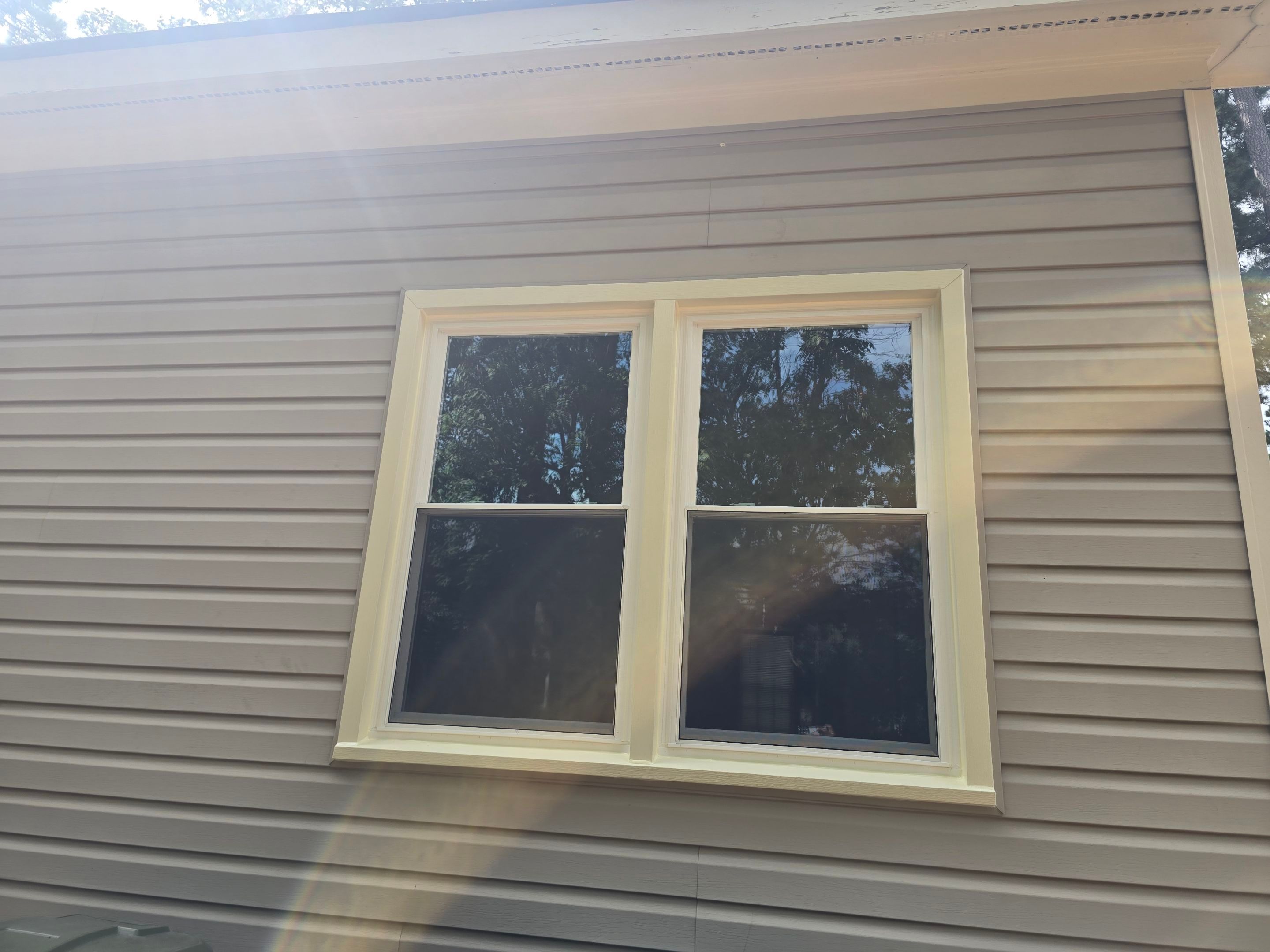 Arched and Double-Hung Window Replacement with Custom Trim in Wilson by The Remodeling Company