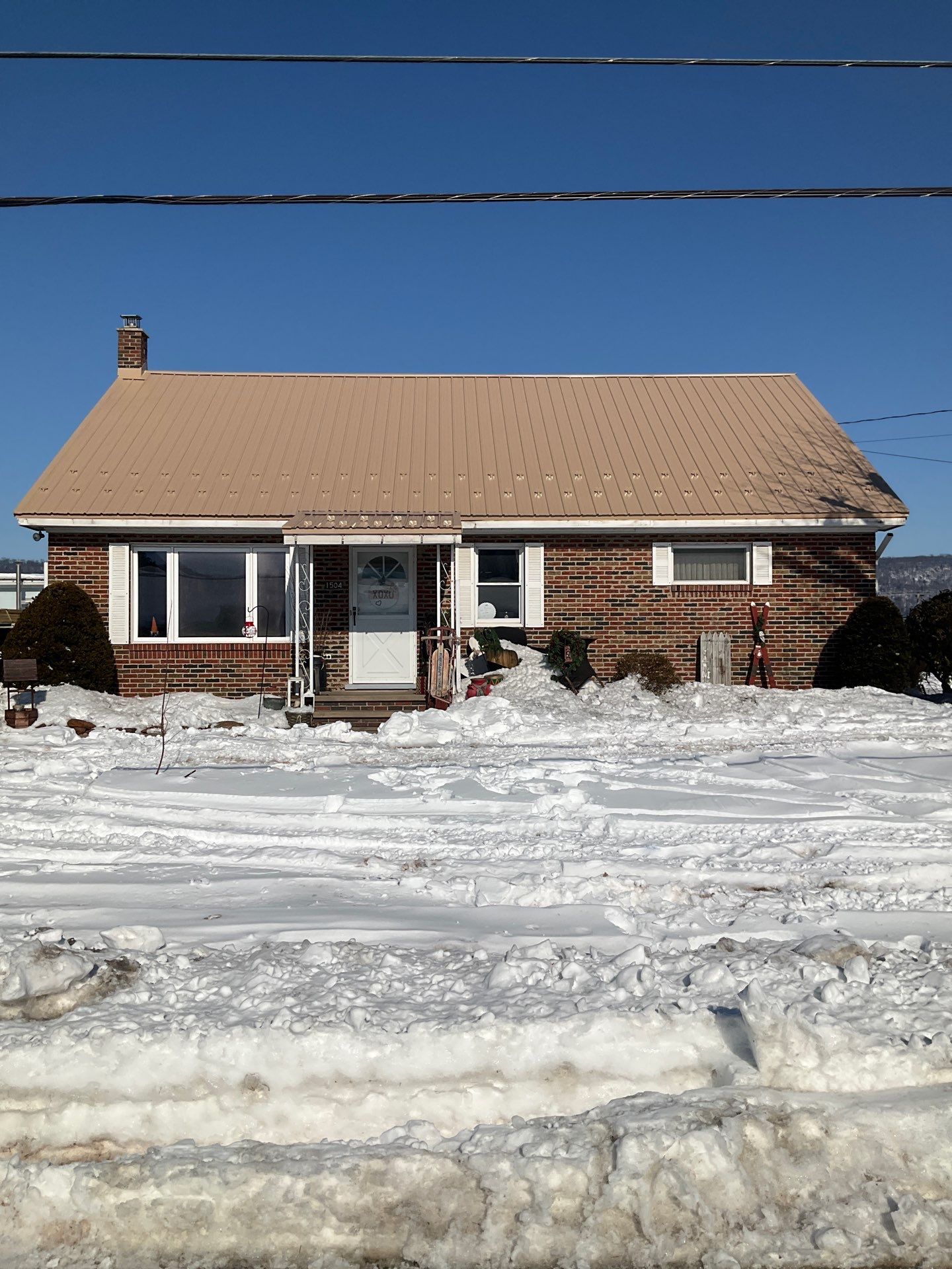 Tan Metal Roof and Gutter Replacement for Valley View Home by Esh Builders