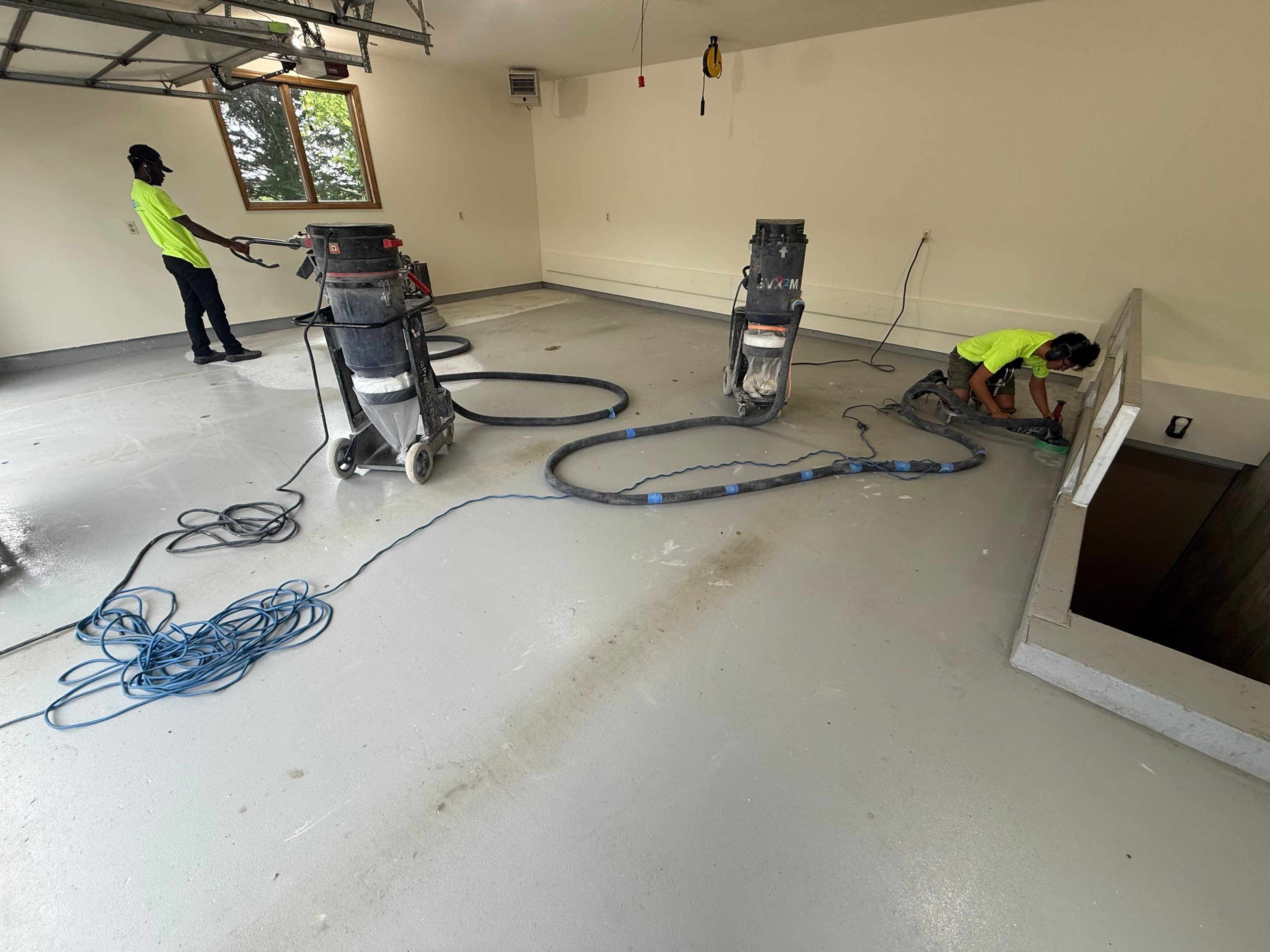 Custom Polyaspartic Garage Floor and Stairwell Coating in Pipestone by Select Painting, Coatings & Garage Cabinets