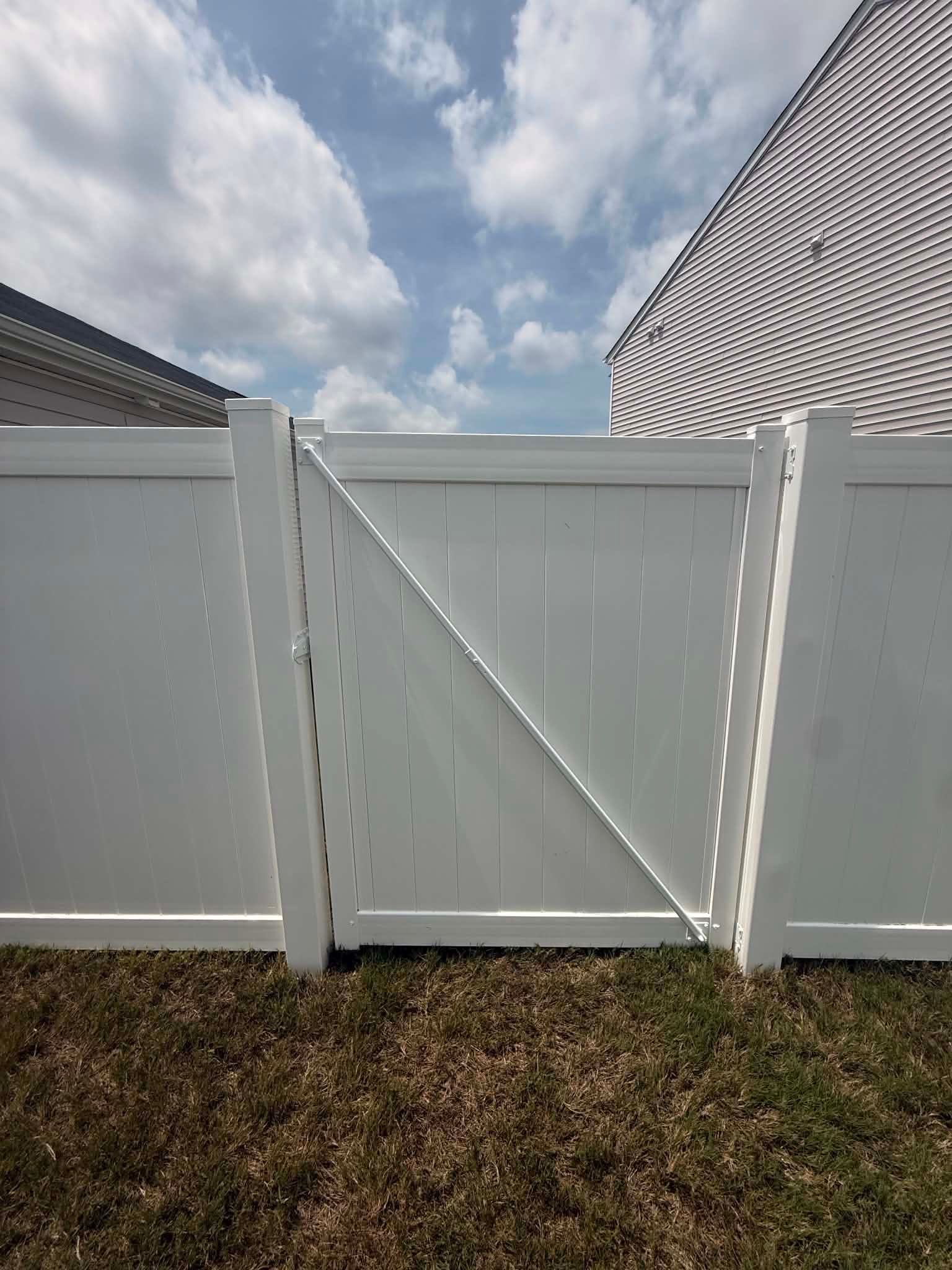Vinyl Privacy Fence Installation for Greenville Residence by Superior Fence and Rail
