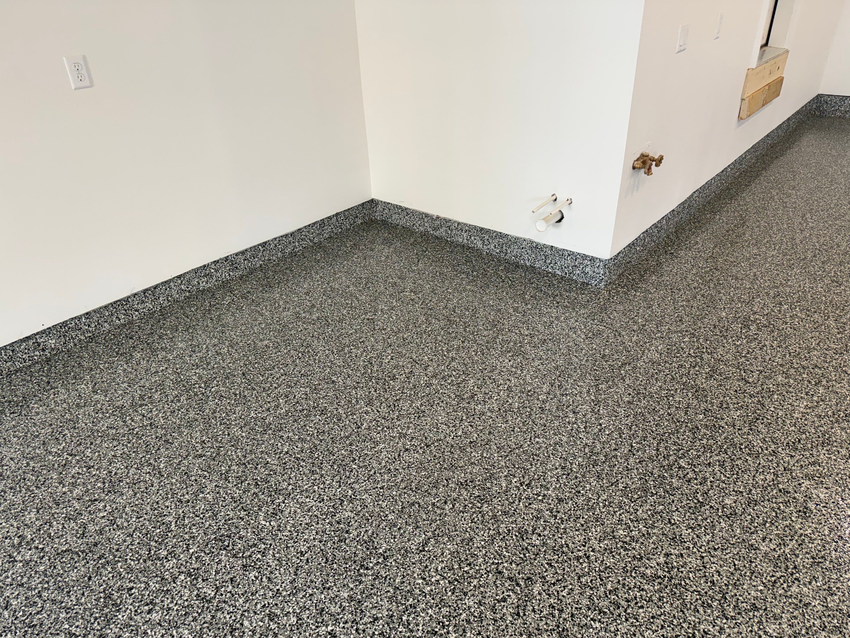 Multi-Car Garage Epoxy Floor Coating and Concrete Finishing in Sioux Falls by Select Painting, Coatings & Garage Cabinets
