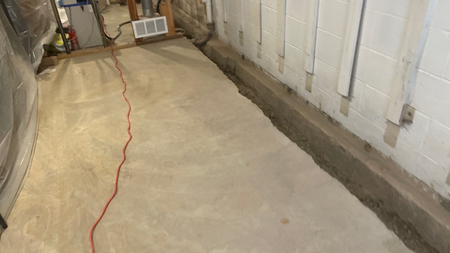 Interior Drain Tile & Buried Discharge in St. Anthony, MN by Waterproofing Northeast