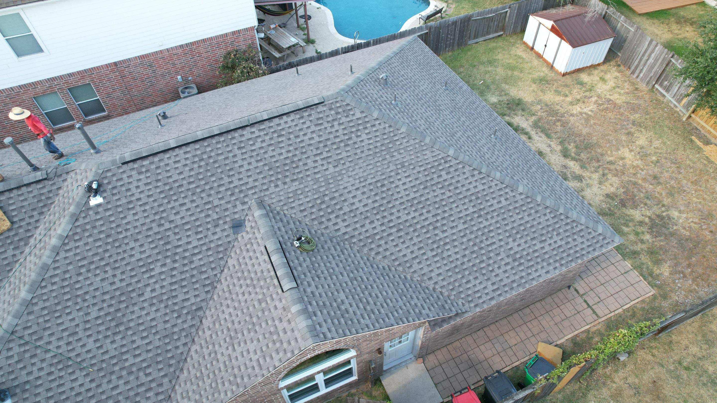 Full Roof Replacement on Two-Story Brick Home — Spring, TX by PL Roofing & SB Roofing, LLC.