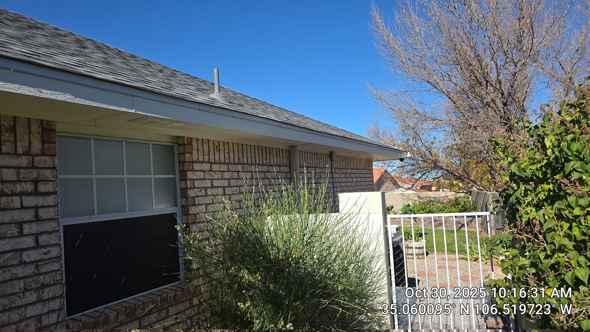 Seamless White Gutter and Downspout Installation in Albuquerque by Doyle Roof Masters Inc