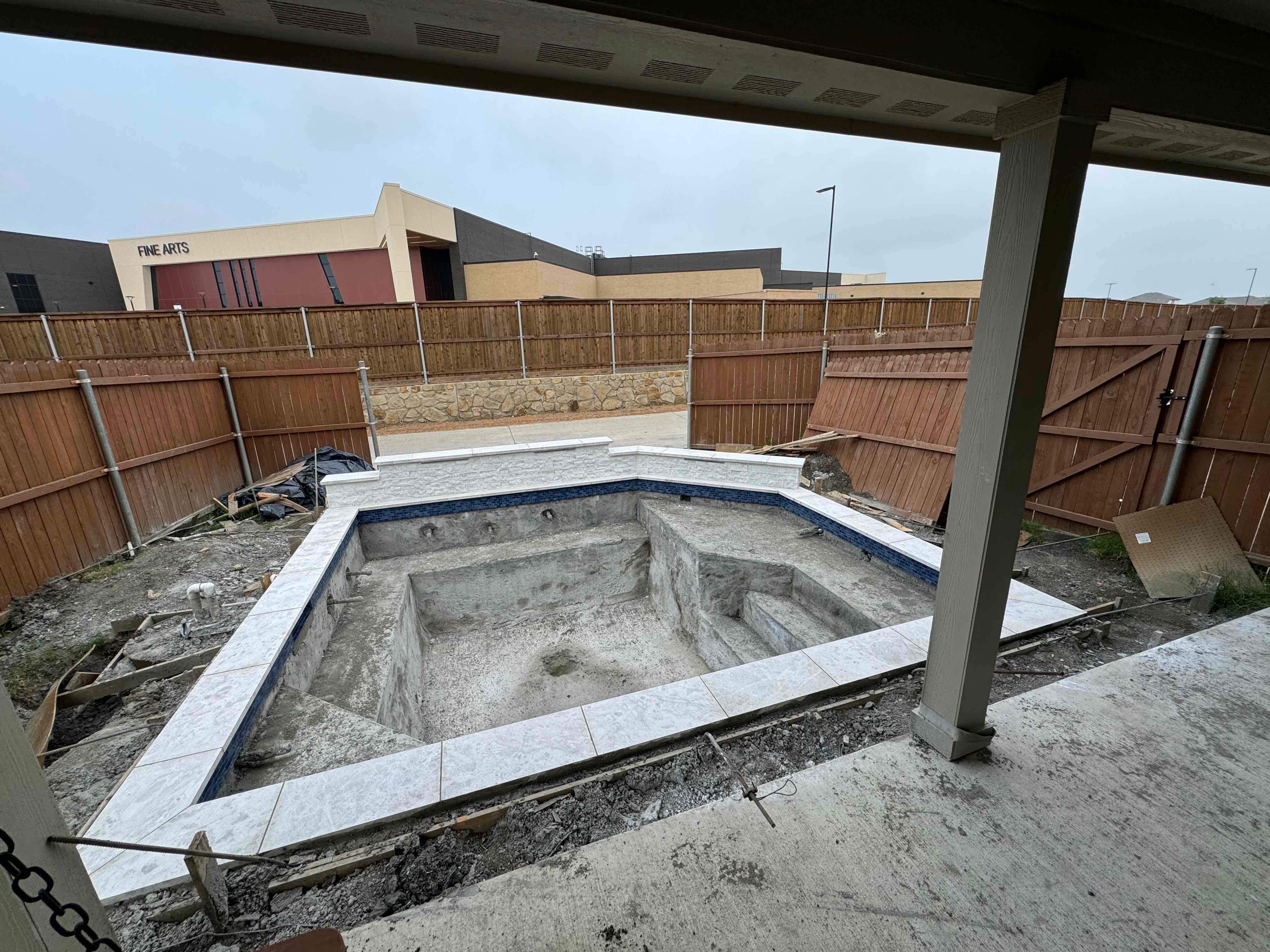 Geometric Pool with Raised Spa and Tanning Ledge by Pinnacle Pools and Spas - DFW
