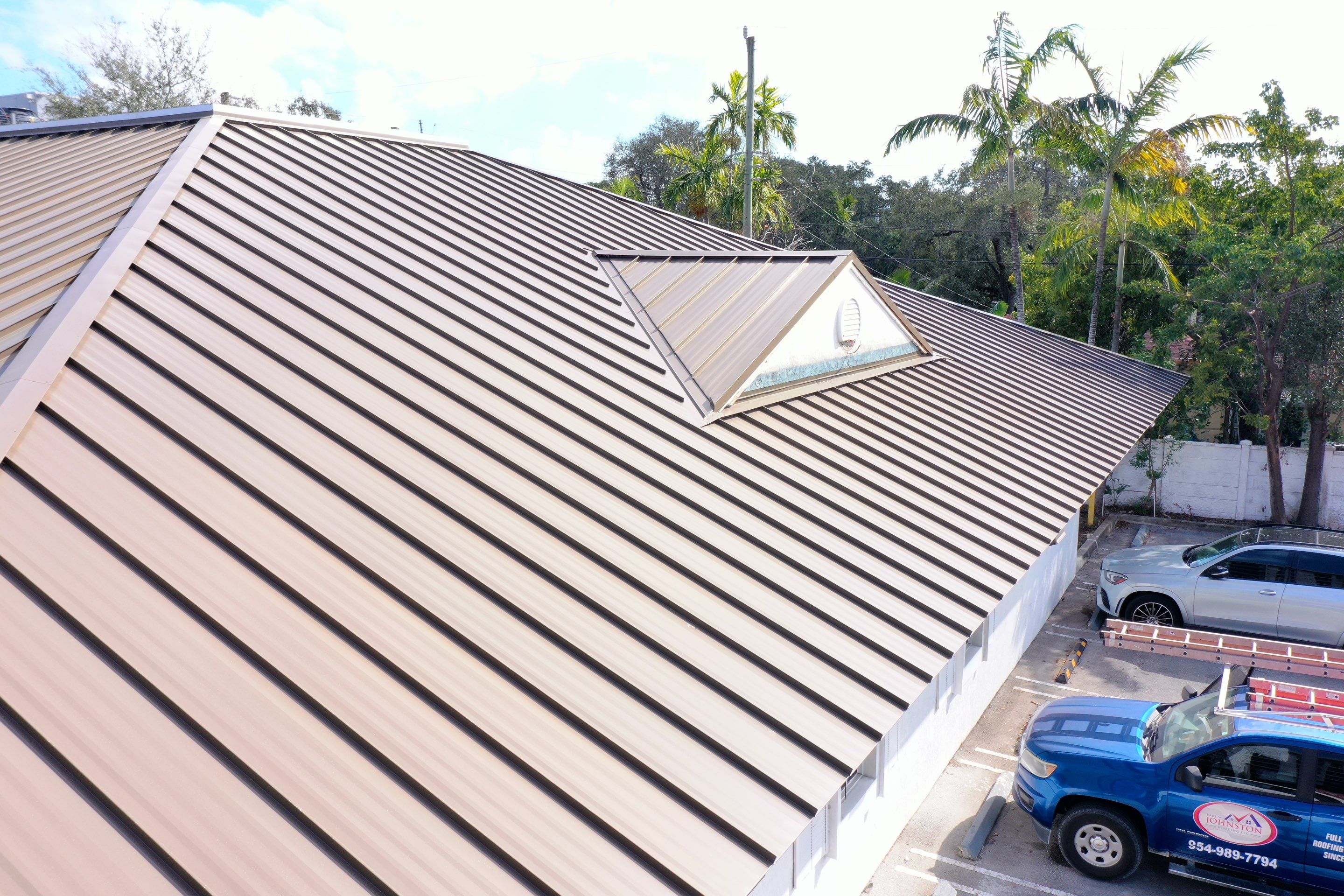 COMMERCIAL REROOF 24 GUAGE MEDIUM BRONZE 1-1/2" MECHANICAL SEAM "ZEBRA METHOD" by Earl W. Johnston Roofing 