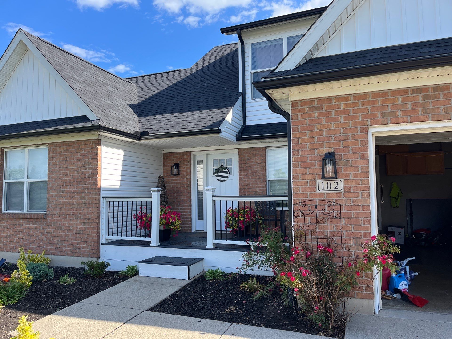 Exterior Installation using Onyx Black Durations and White Siding by WIW Enterprises Inc