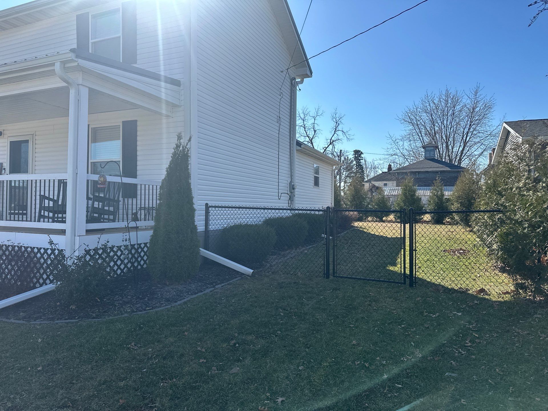 Black Chain Link Backyard Fence Installation in Independence by Perfect Picket Fence and Stain