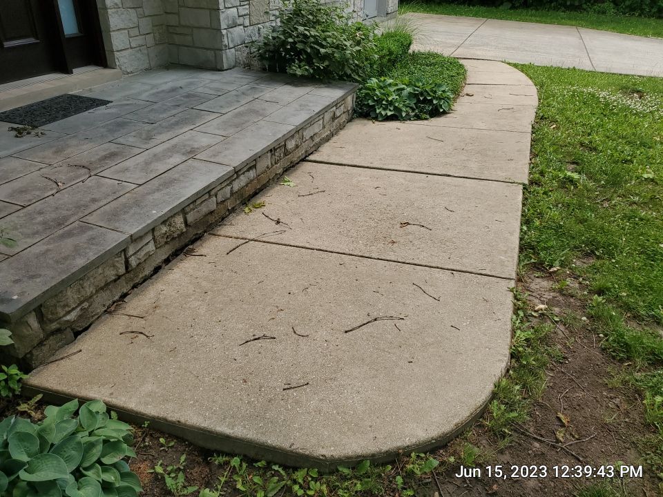 Highland Park, IL Bluestone, concrete,  Trex deck cleaning by Northern Power Washing LLC.
