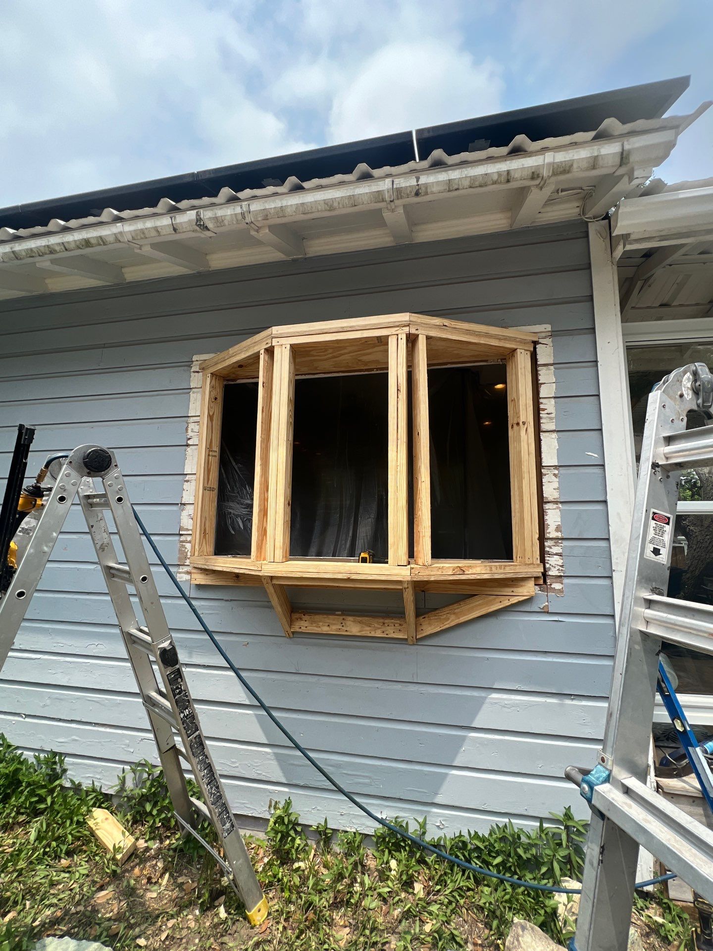 Installing Windows on a Submarine  by Bayfront Roofing and Construction