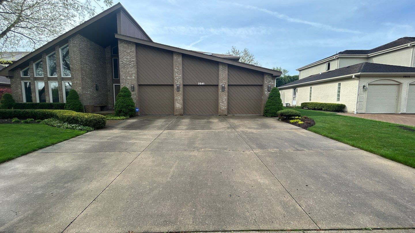 concrete patio and driveway cleaning by Northern Power Washing LLC.