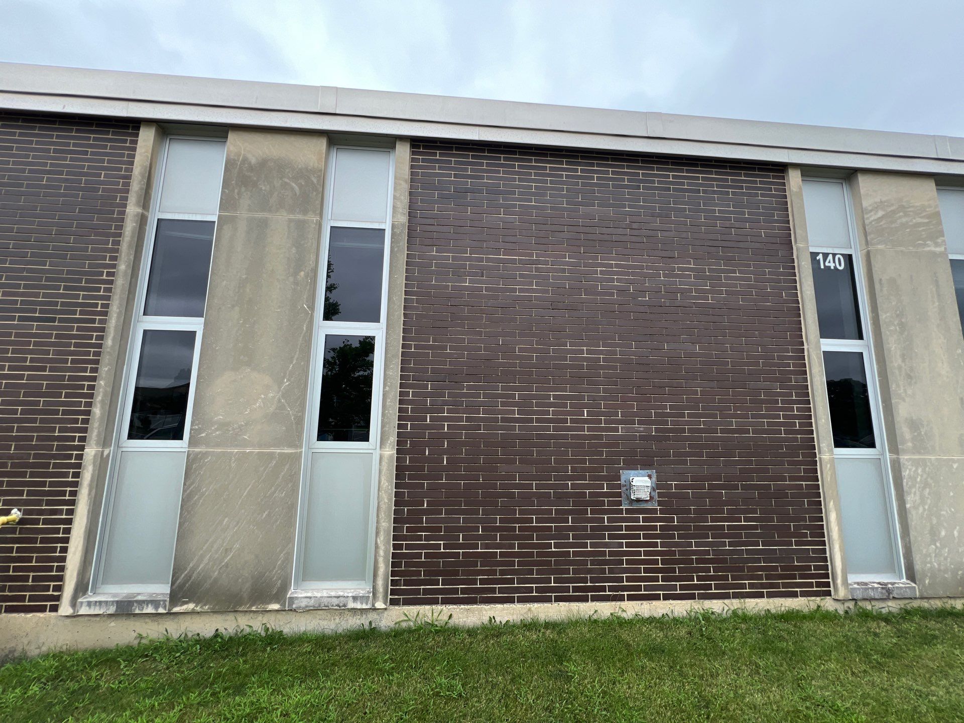 commercial pressure washing using Algaecide, soft wash soap by Northern Power Washing LLC.
