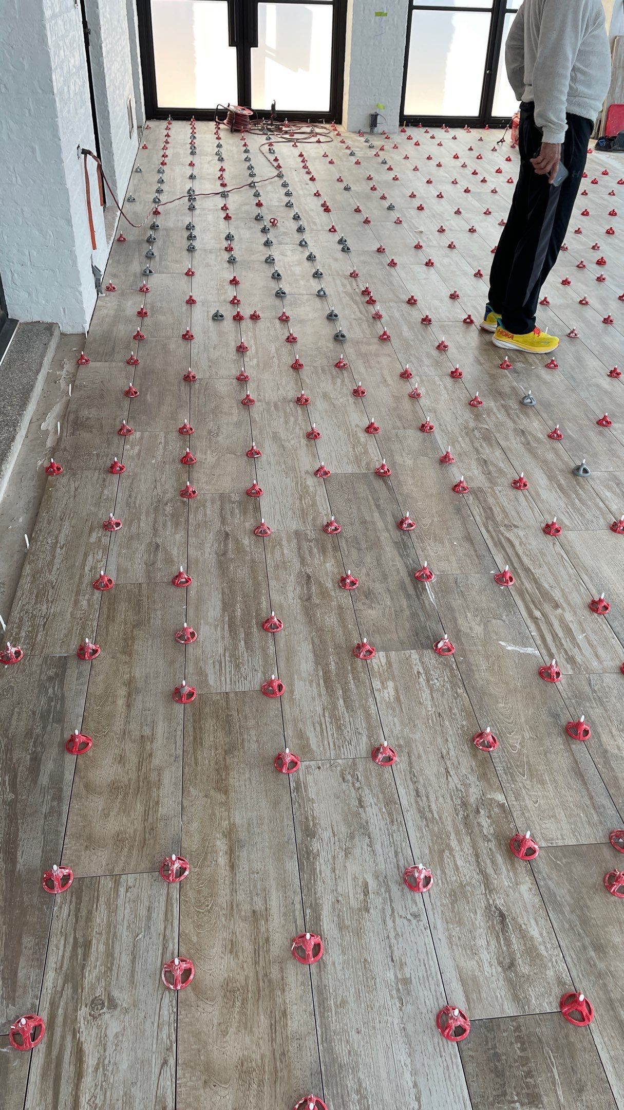 Instant Transformation of this Beautiful Sunroom by Footprints Floors of Coastal Carolina