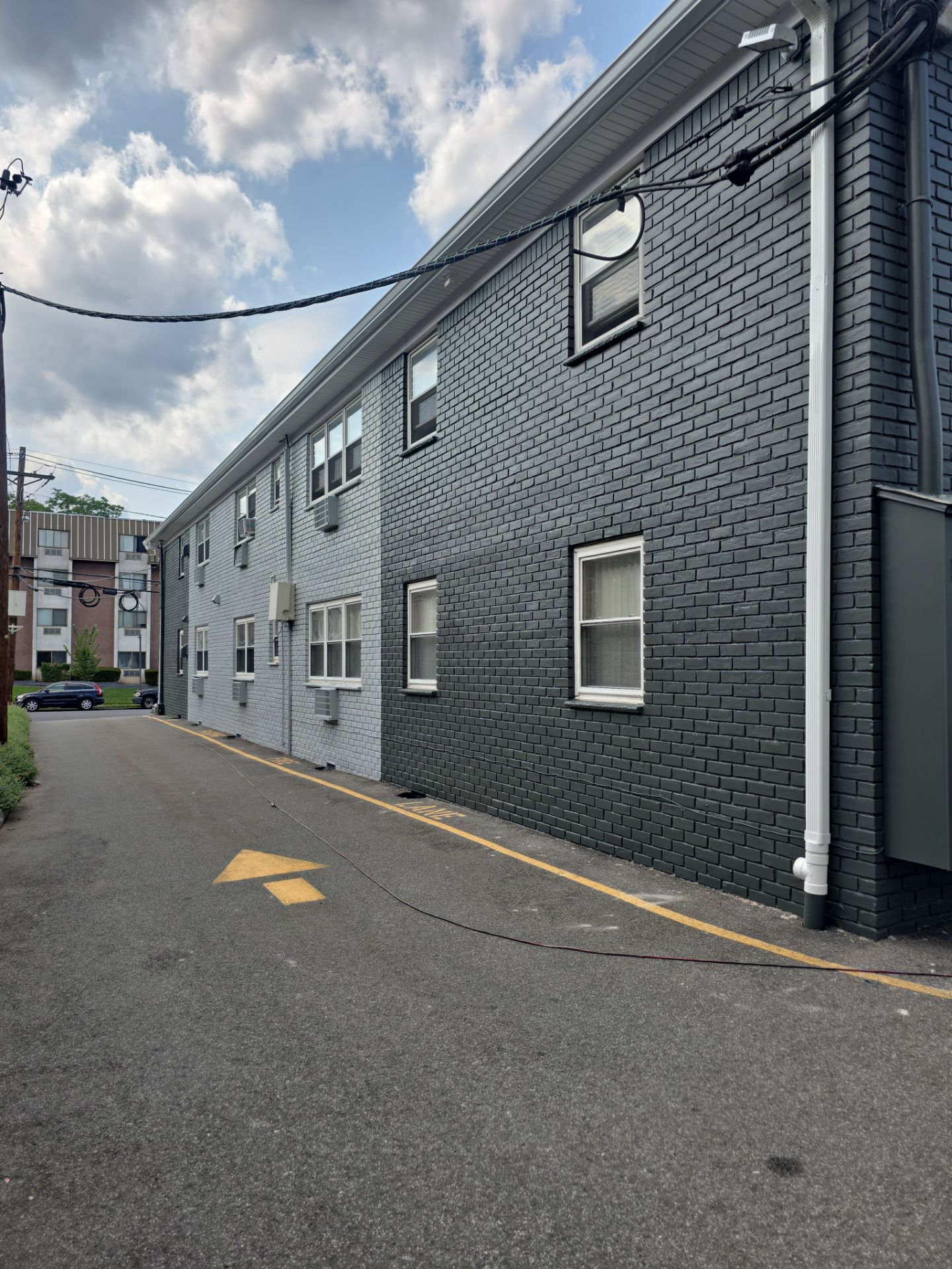 Multi-Unit Apartment Complex Exterior Brick Painting Project in Hackensack by Spectrum Painting, LLC