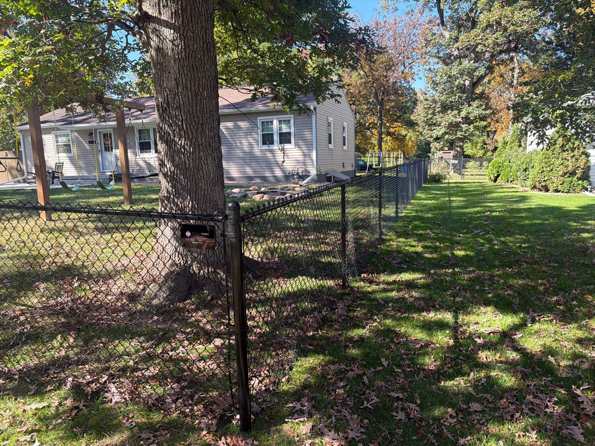 Residential Black Chain Link Fencing in Cedar Falls by Perfect Picket Fence and Stain