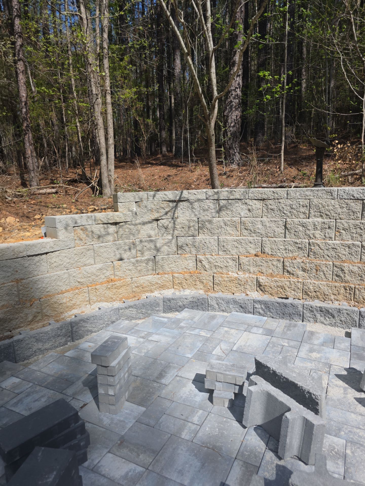 Pittsboro Outdoor Living Transformation – Retaining Wall, Paver Patio & Elevated Deck by Elite Remodeling and Design LLC
