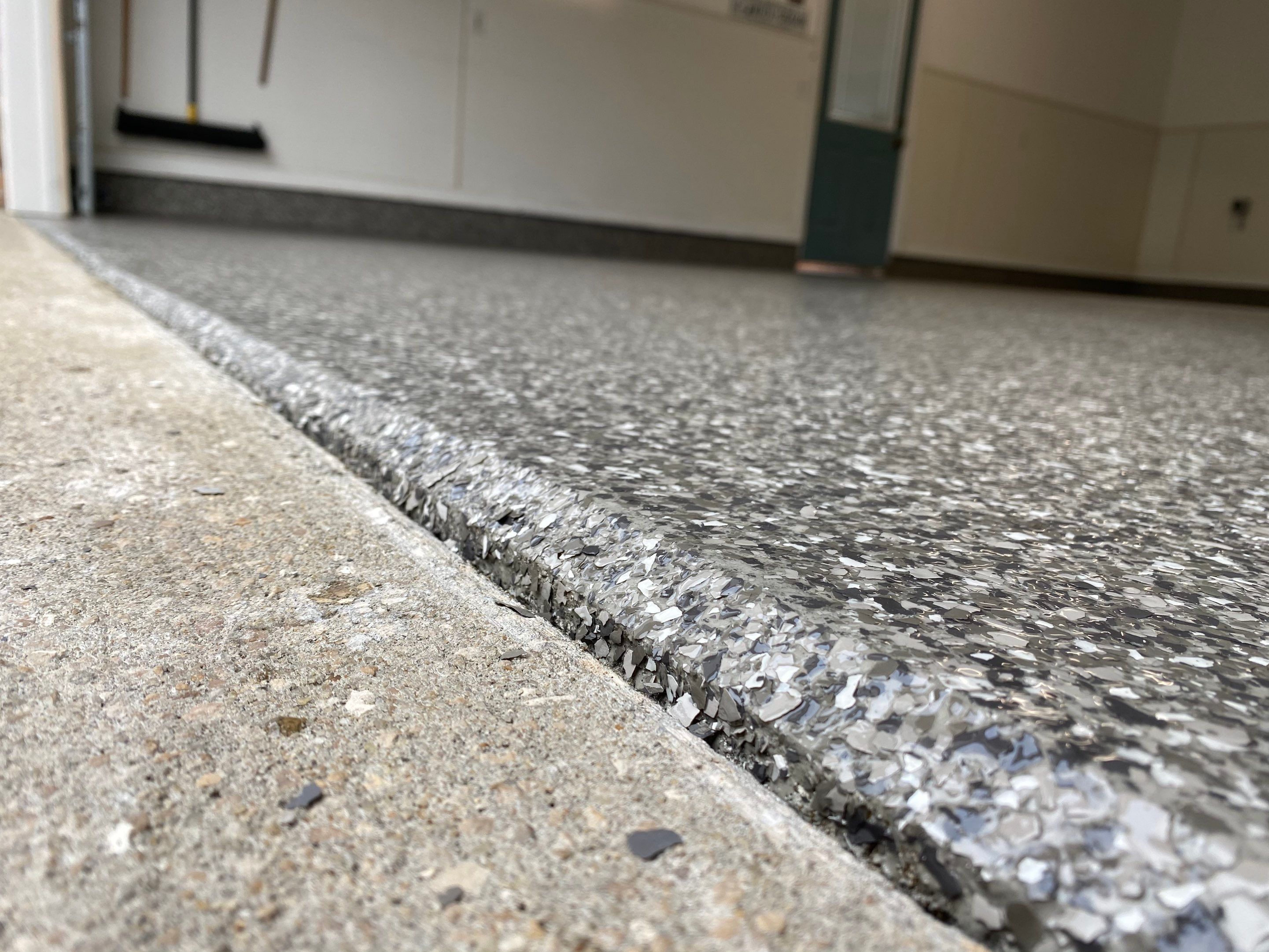 Pebble Beach Garage by Deese Elite Concrete Coatings