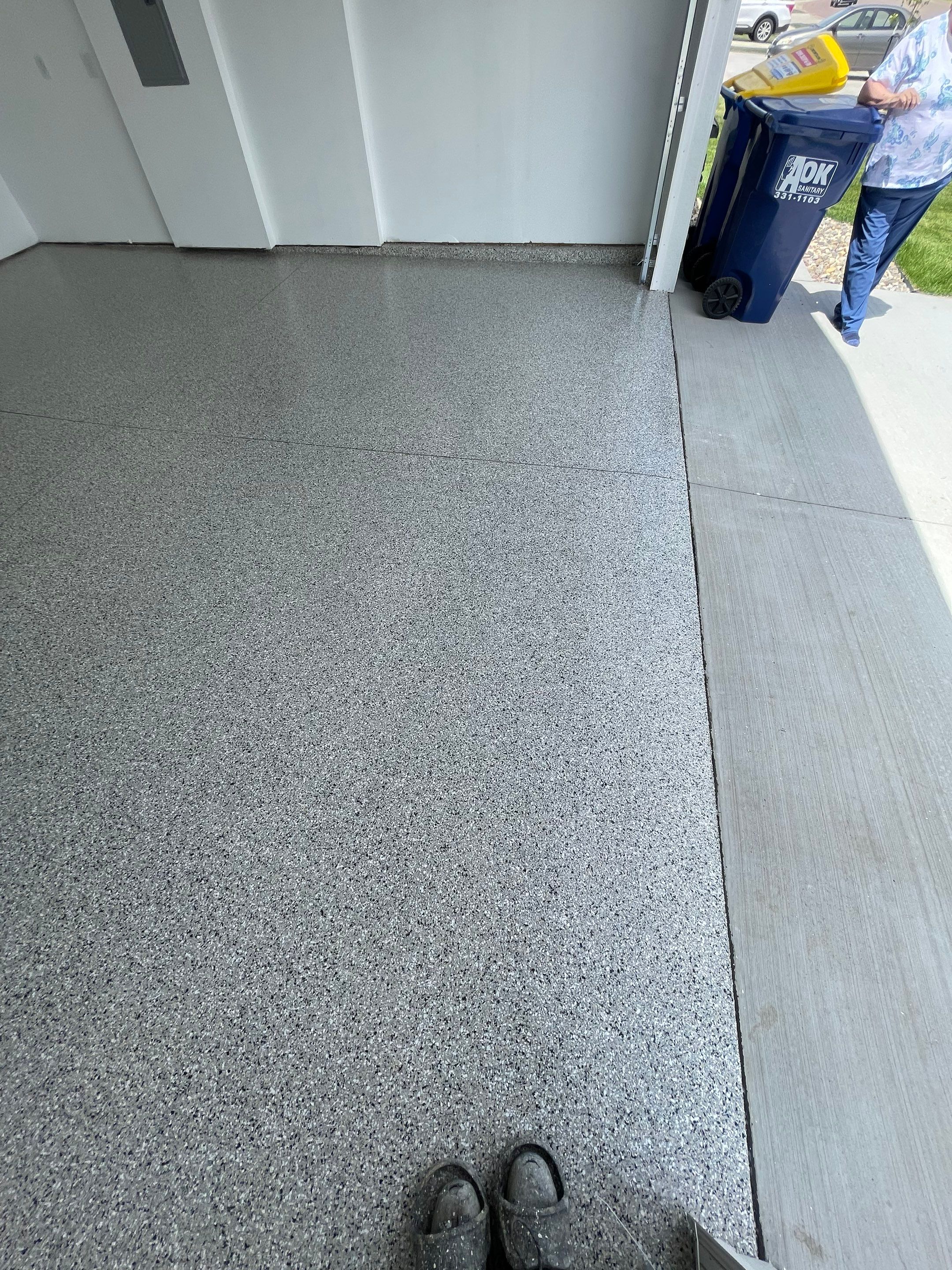Sioux Falls Garage Floor Transformation with Cabin Fever Decorative Chips by Select Painting, Coatings & Garage Cabinets