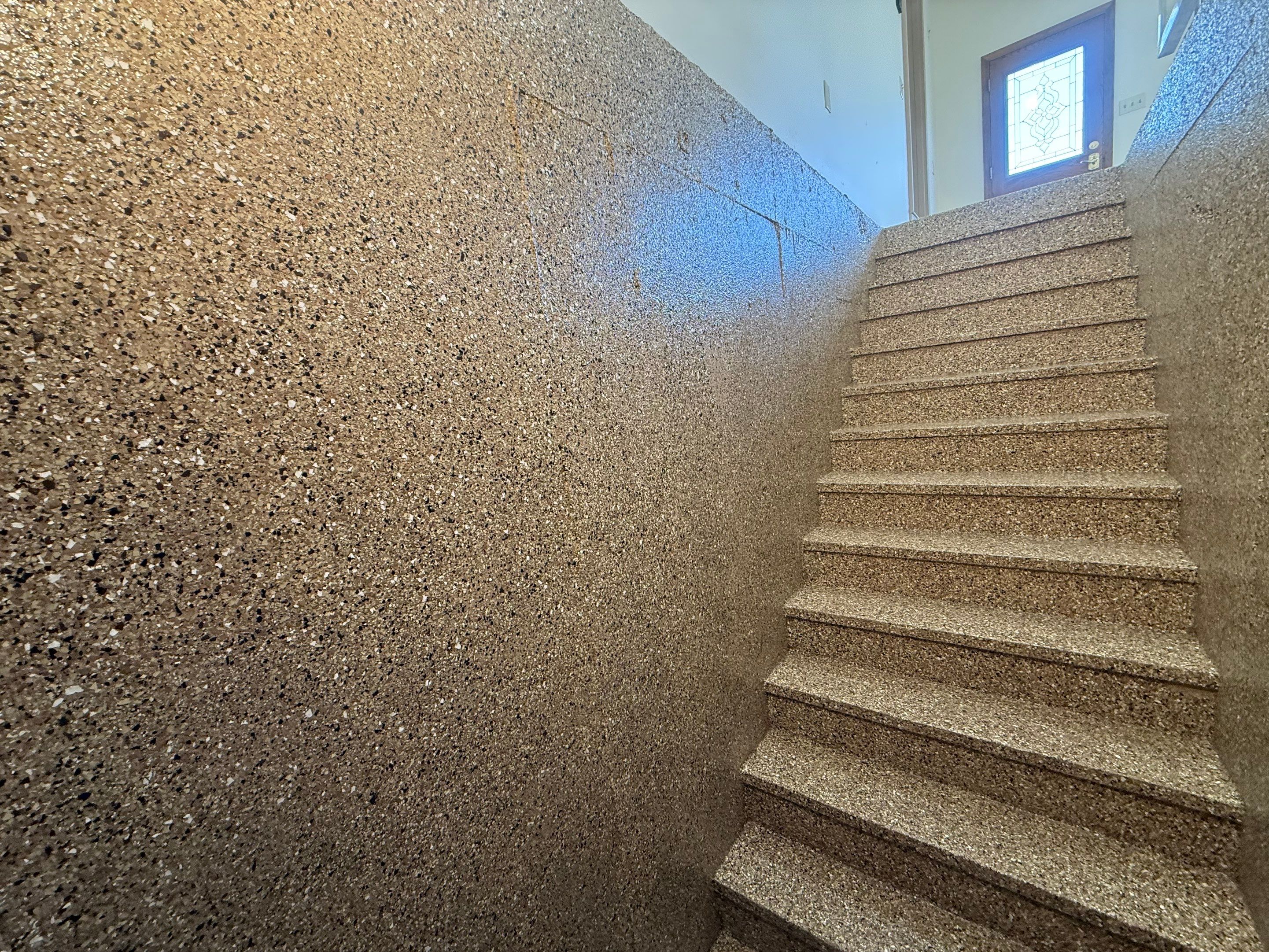 Custom Polyaspartic Garage Floor and Stairwell Coating in Pipestone by Select Painting, Coatings & Garage Cabinets
