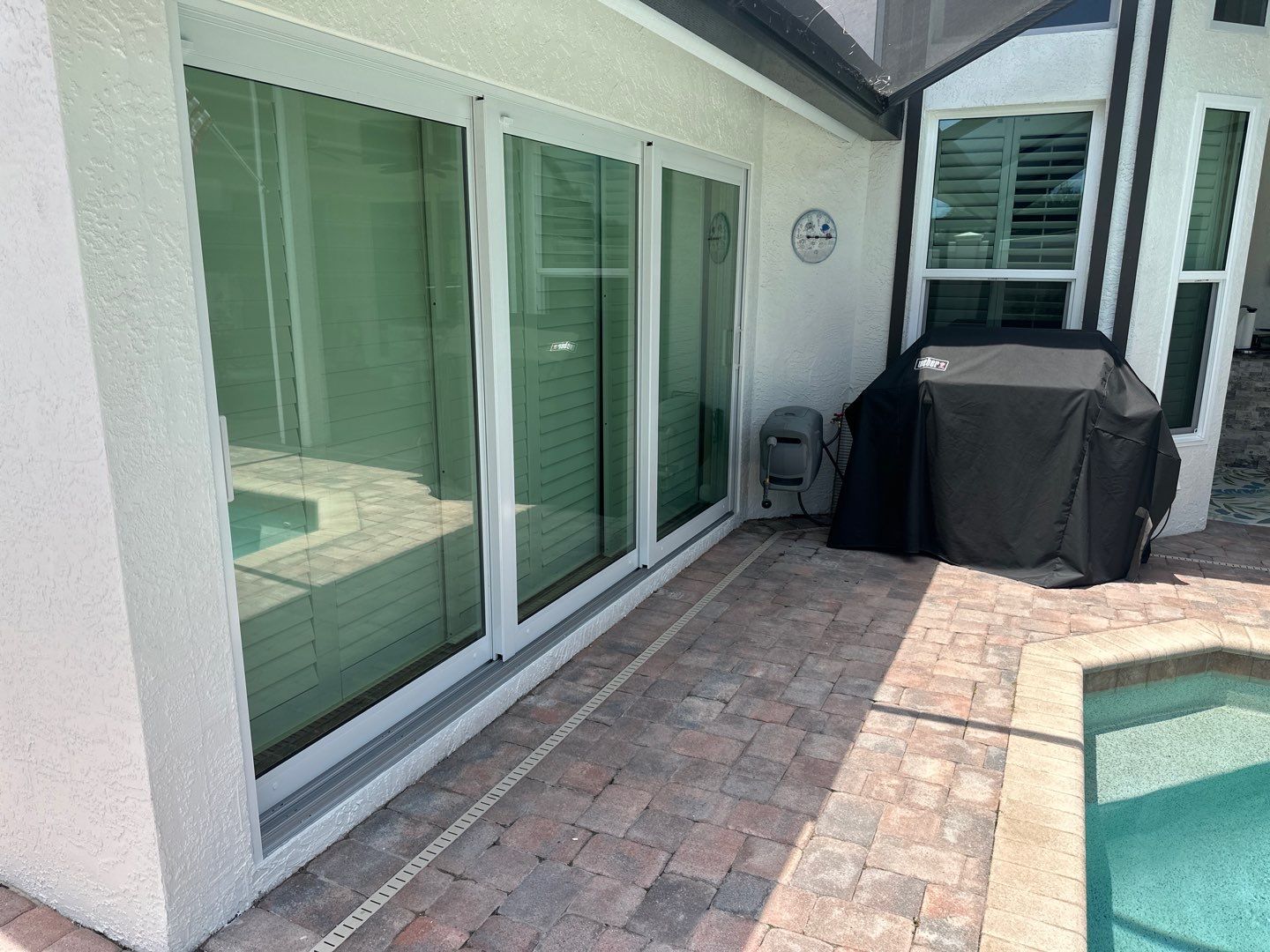 Window Installation using PGT Aluminum for the doors and PGT Vinyl for the Windows  by Windows For Life 