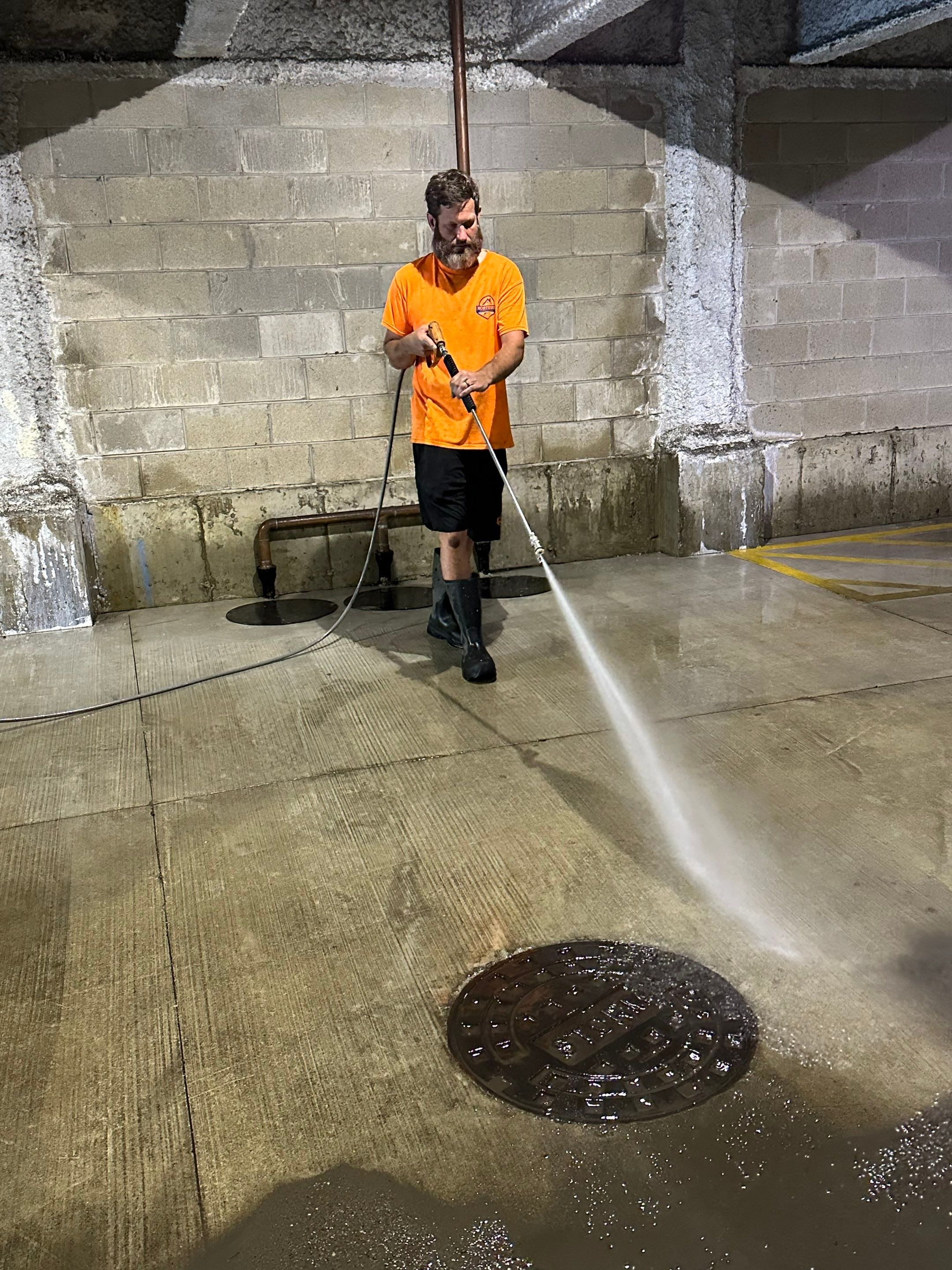 Parking garage using Hot water by Northern Power Washing LLC.