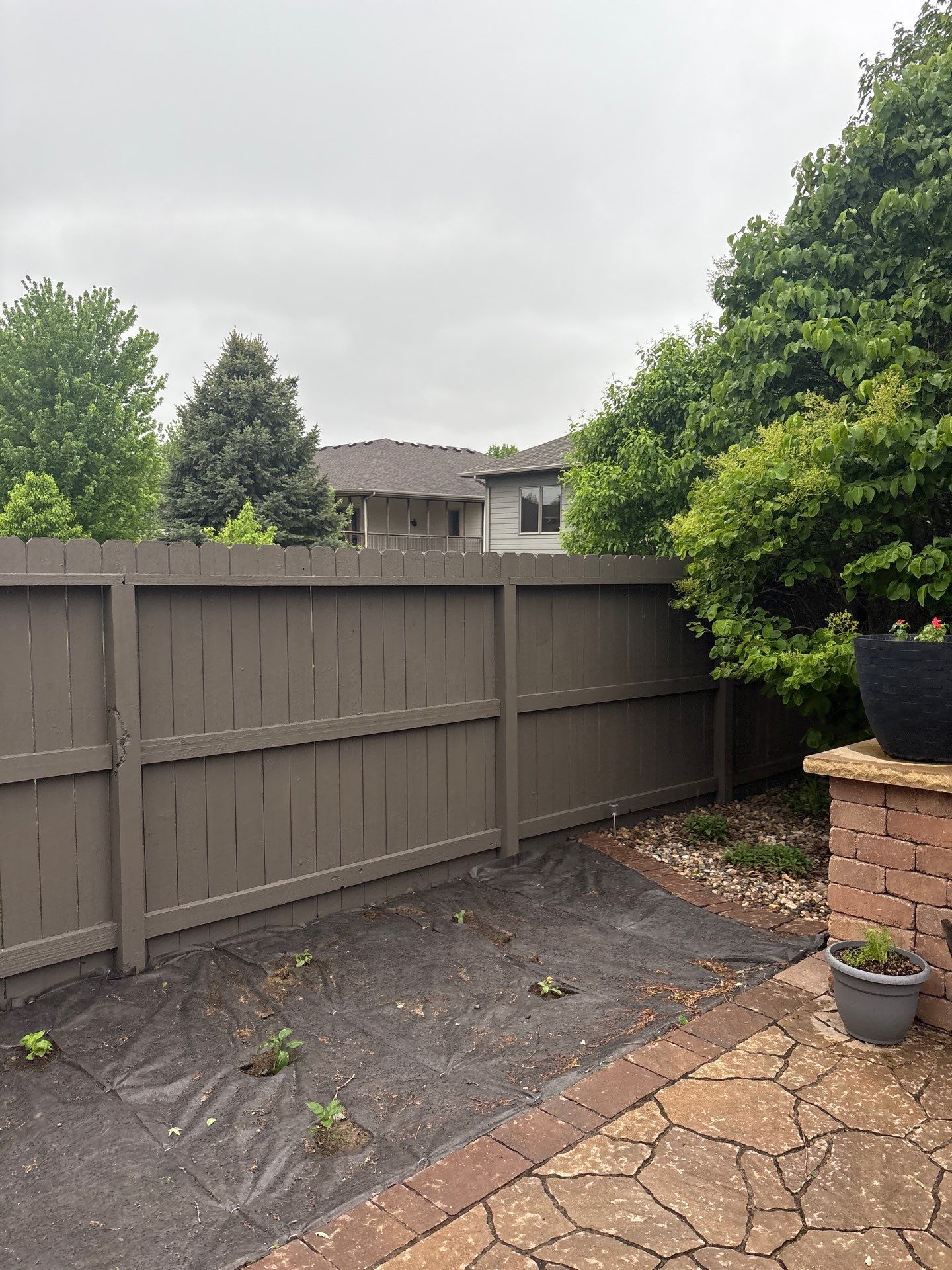 Sioux Falls Residential Exterior Update and Flagstone Pool Deck by Select Painting, Coatings & Garage Cabinets