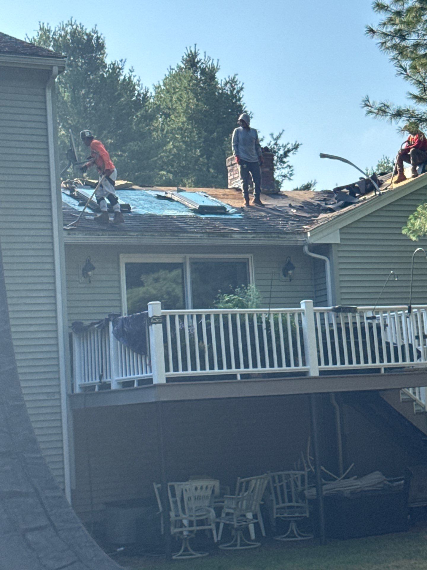 Complete Roof Replacement with Chimney Flashing, Gutter Guard System, and Vinyl Siding Repairs by Mighty Dog Roofing of Greater Middlesex County