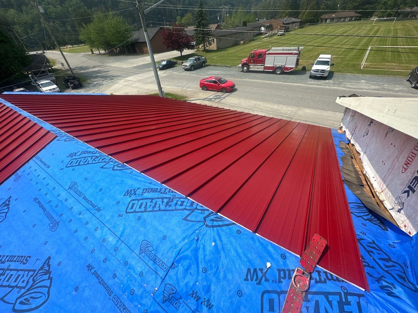 Commercial Roofing Installation using 12" Prolok metal by Top Notch Roofing Inc