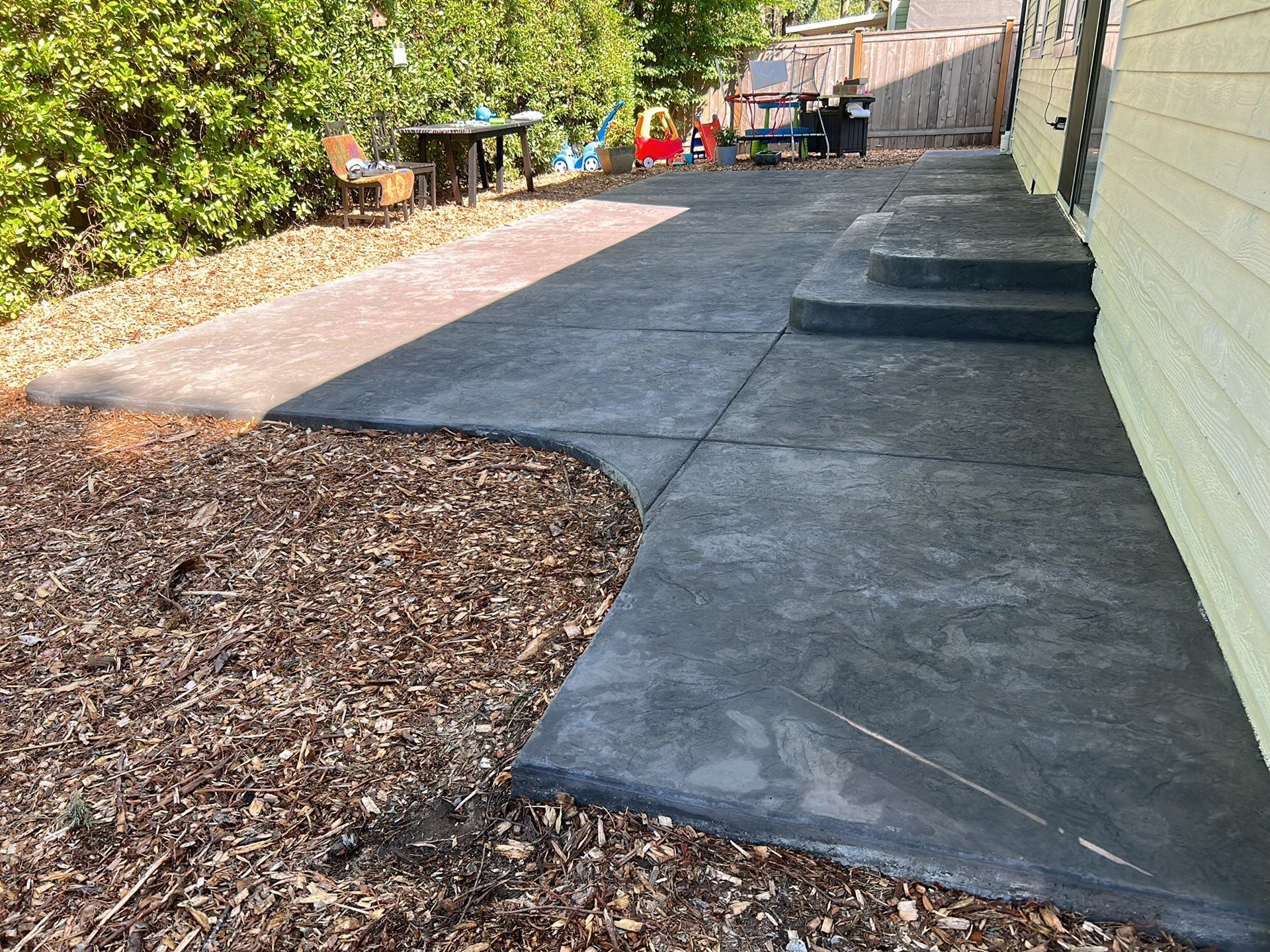 Luo | Colored Stamped Concrete Patio by Jireh Asphalt & Concrete Inc 