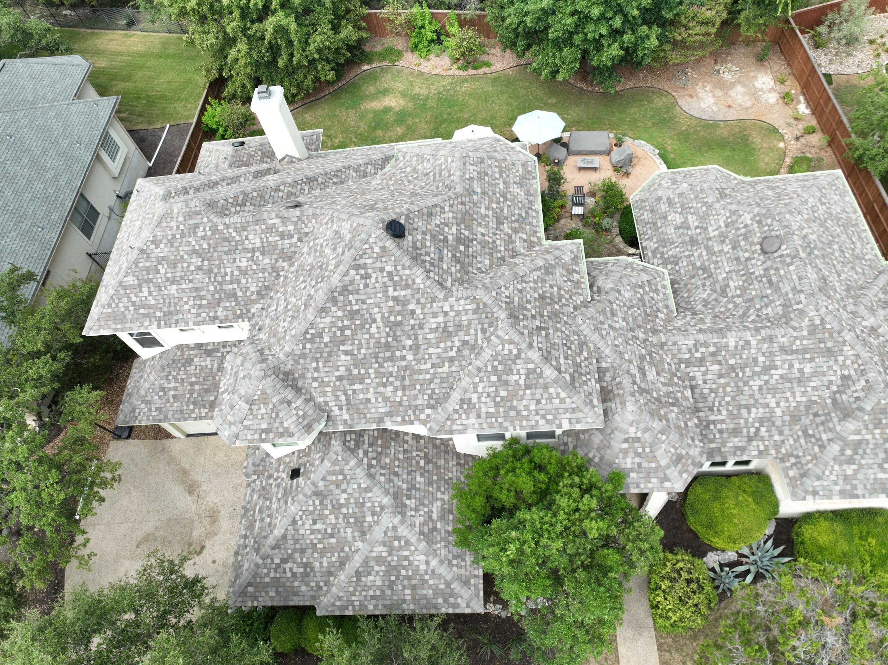 Residential Roof Replacement using 30 Year Laminate Shingles with High Profile Ridge by Premier Roofing and Contracting