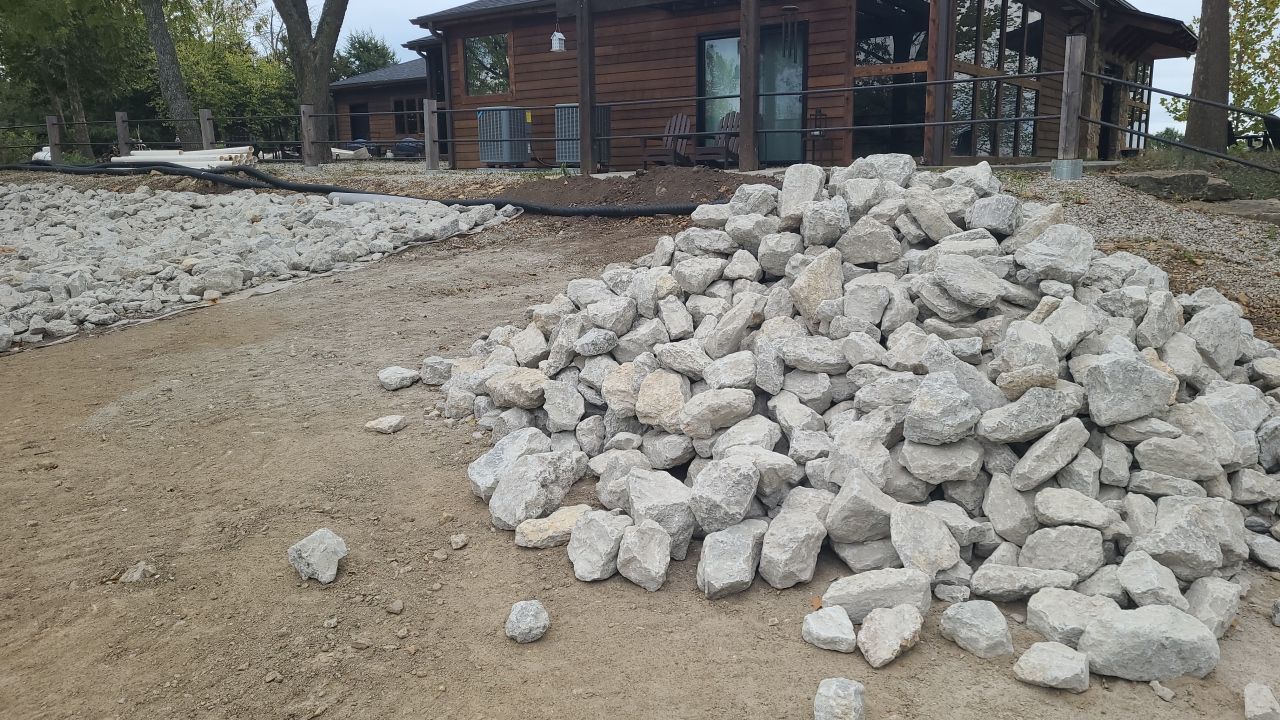 Supporting back of home with backfill at edge of steep creek by LAND ESCAPES LLC
