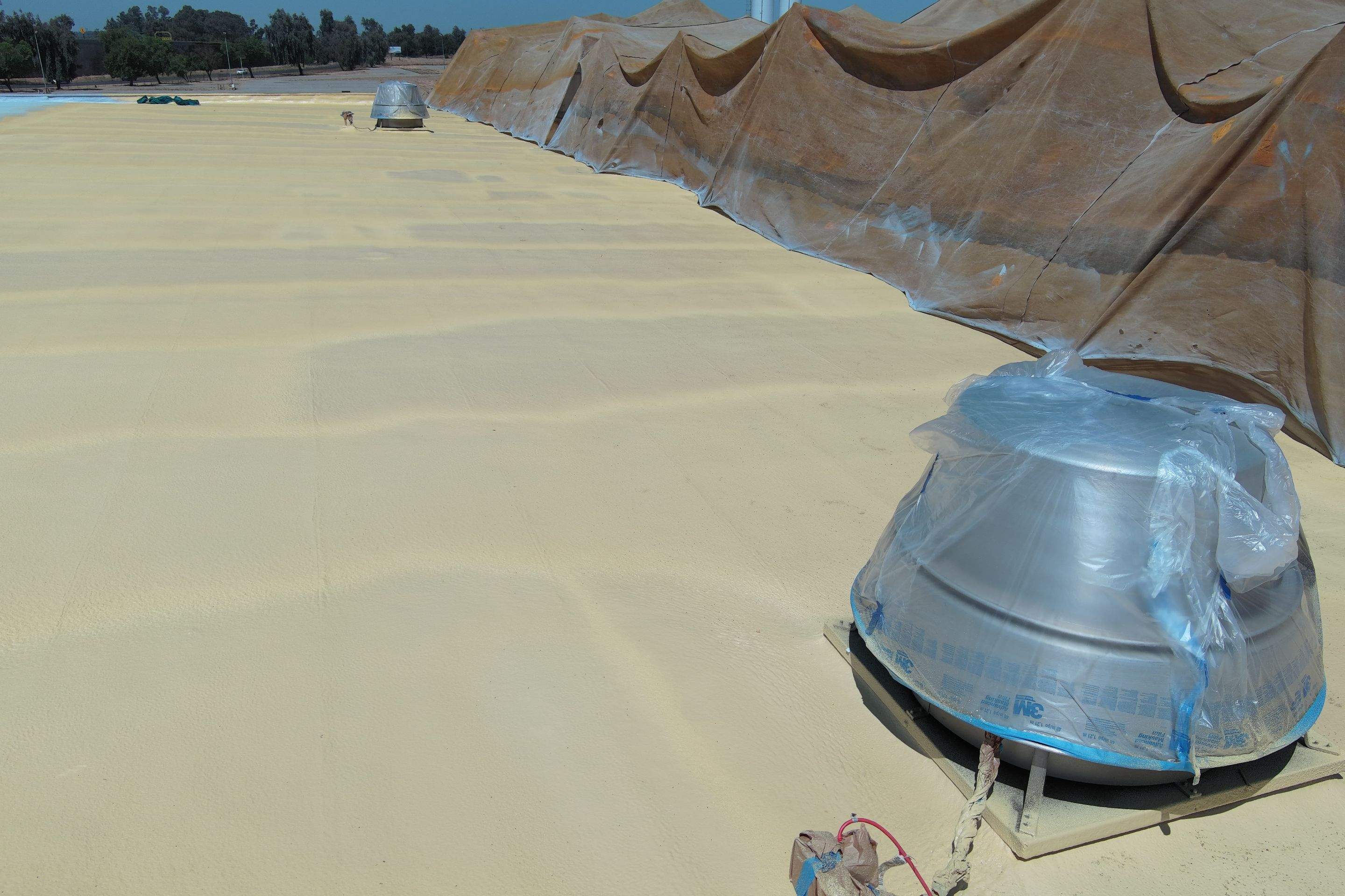 Pro Farms Spray foam roofing project by Straight Edge Roofing Inc