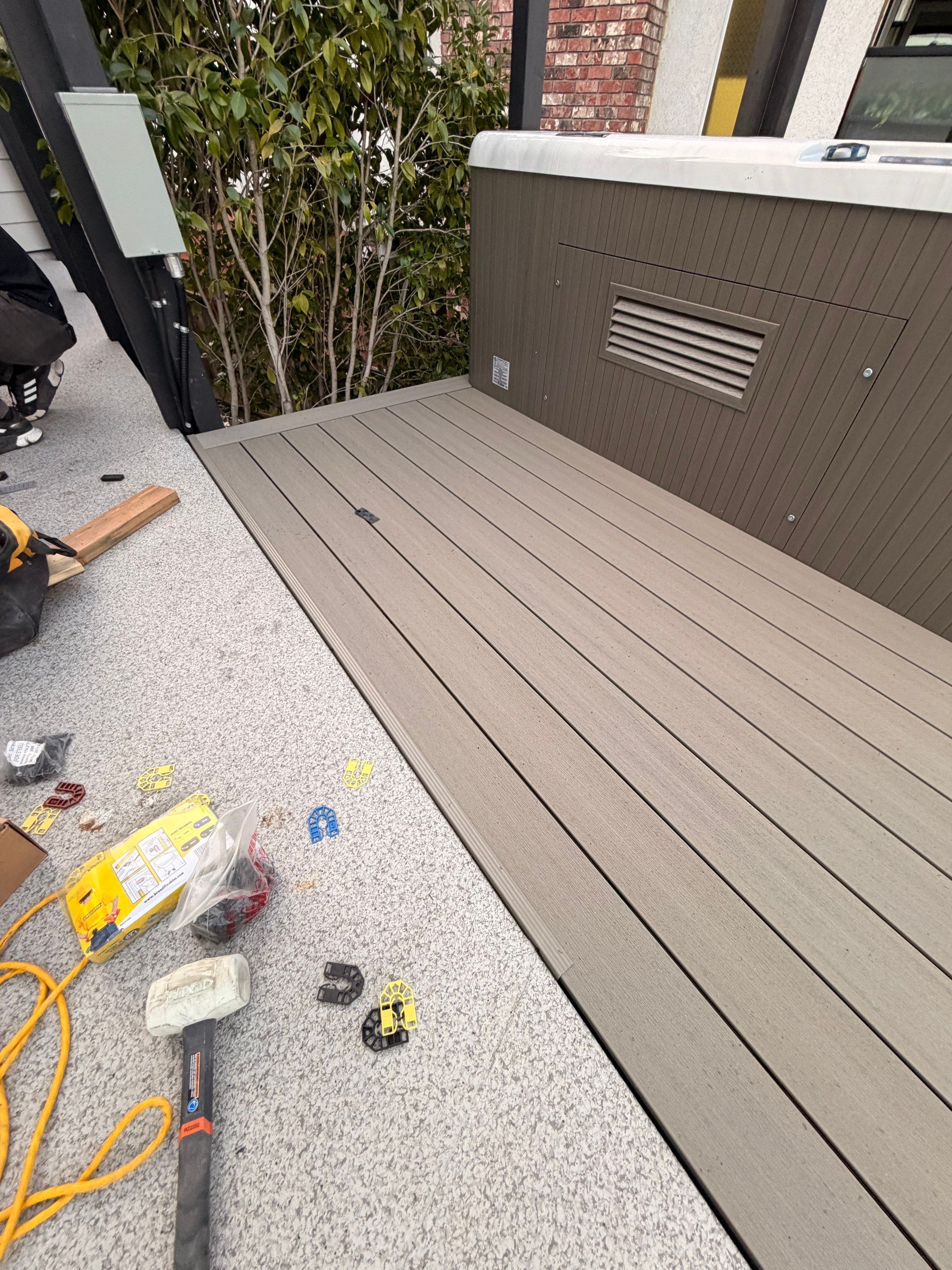 New Composite Deck with glass railing in North Vancouver by YVR Construction Group