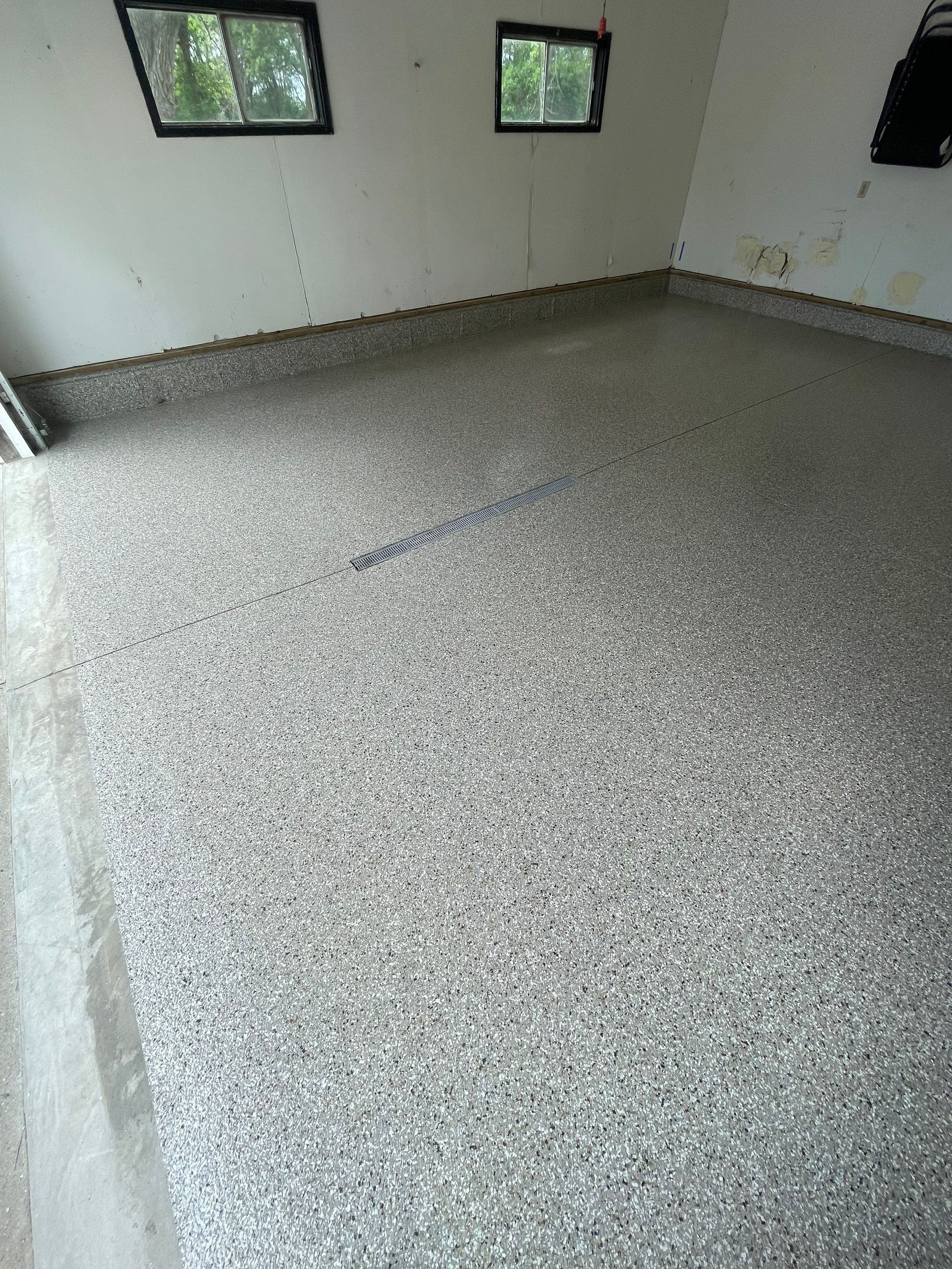 Hartford Residential Garage Floor Transformation With Decorative Chip Coating by Select Painting, Coatings & Garage Cabinets
