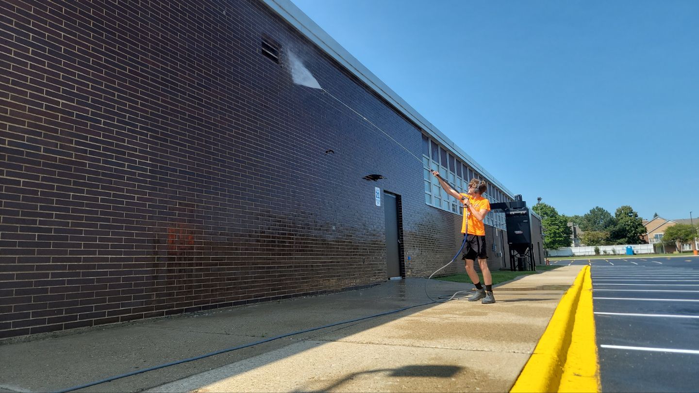 commercial pressure washing using Algaecide, soft wash soap by Northern Power Washing LLC.