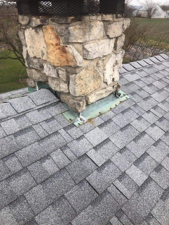 Storm damage roof replacement by Nitro Roofing and Construction