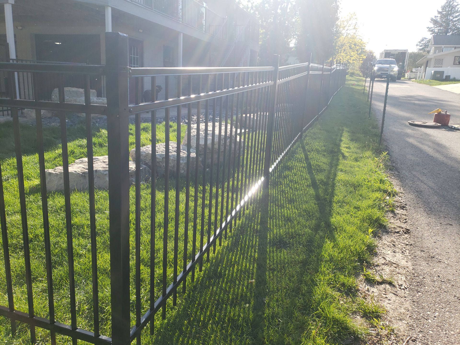 Ornamental Black Metal Picket Fence Installation in Cedar Falls by Perfect Picket Fence and Stain