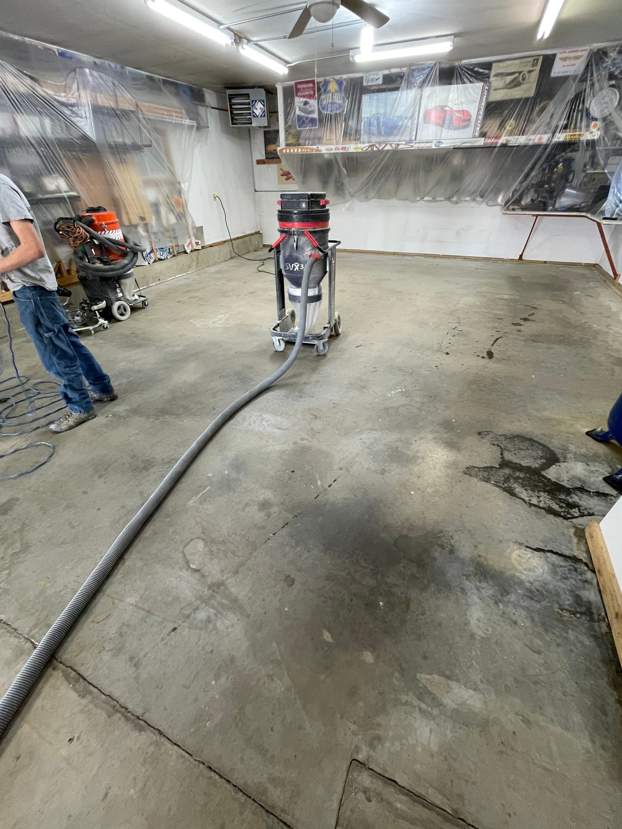 High-Performance Polyurea Garage Floor Coating and Stem Wall Finishing in Sioux Falls by Select Painting, Coatings & Garage Cabinets
