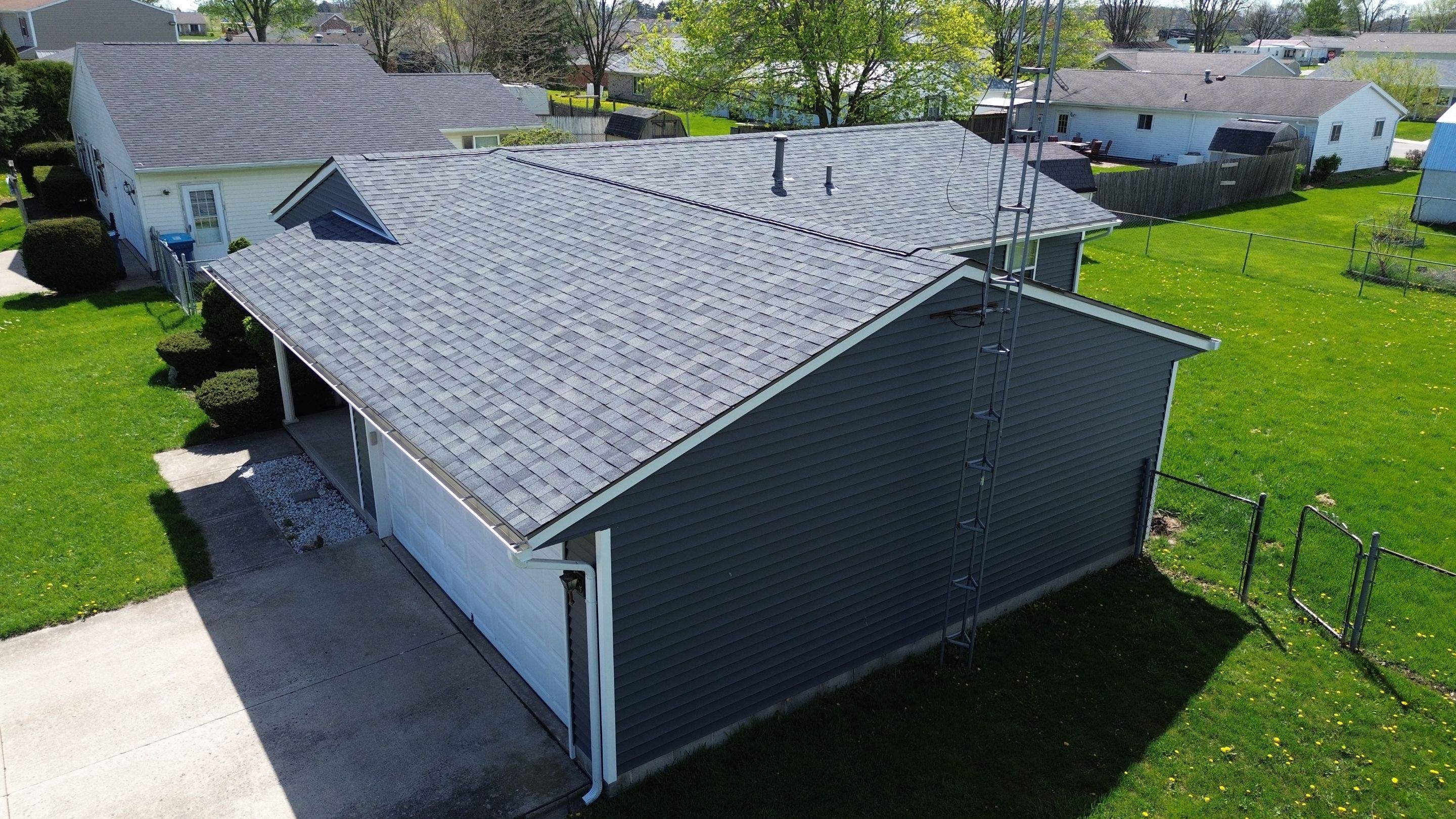 Storm Damage Residential Roof and Siding Installation by WIW Enterprises Inc