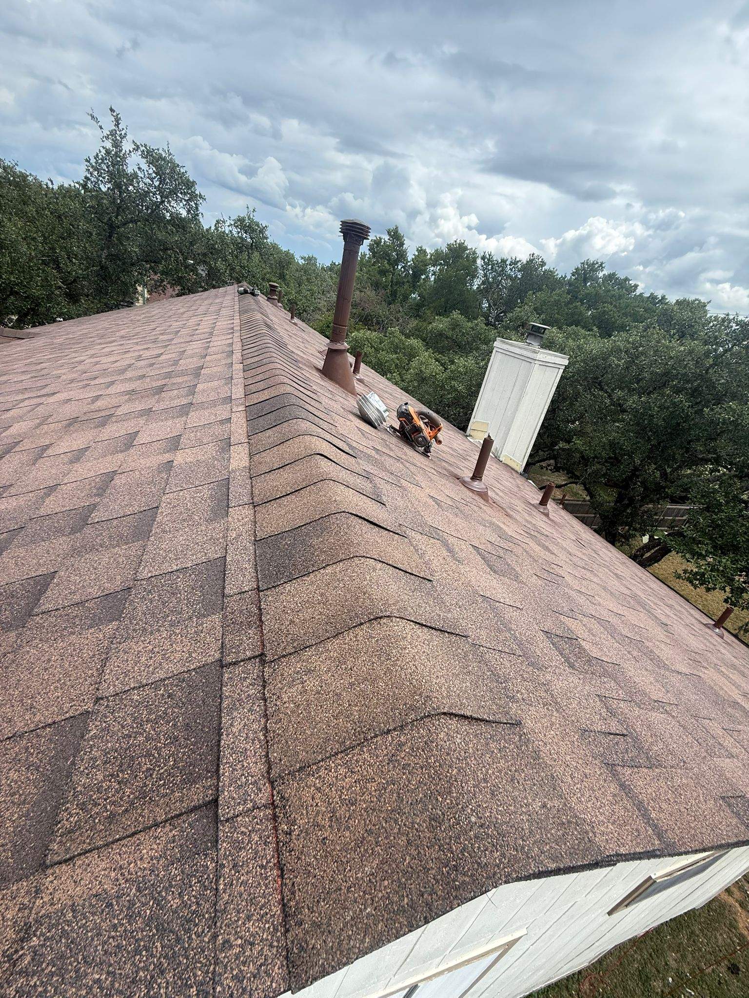Residential Roofing Replacement and Chimney Flashing Repair in Austin by Caliber Restoration LLC