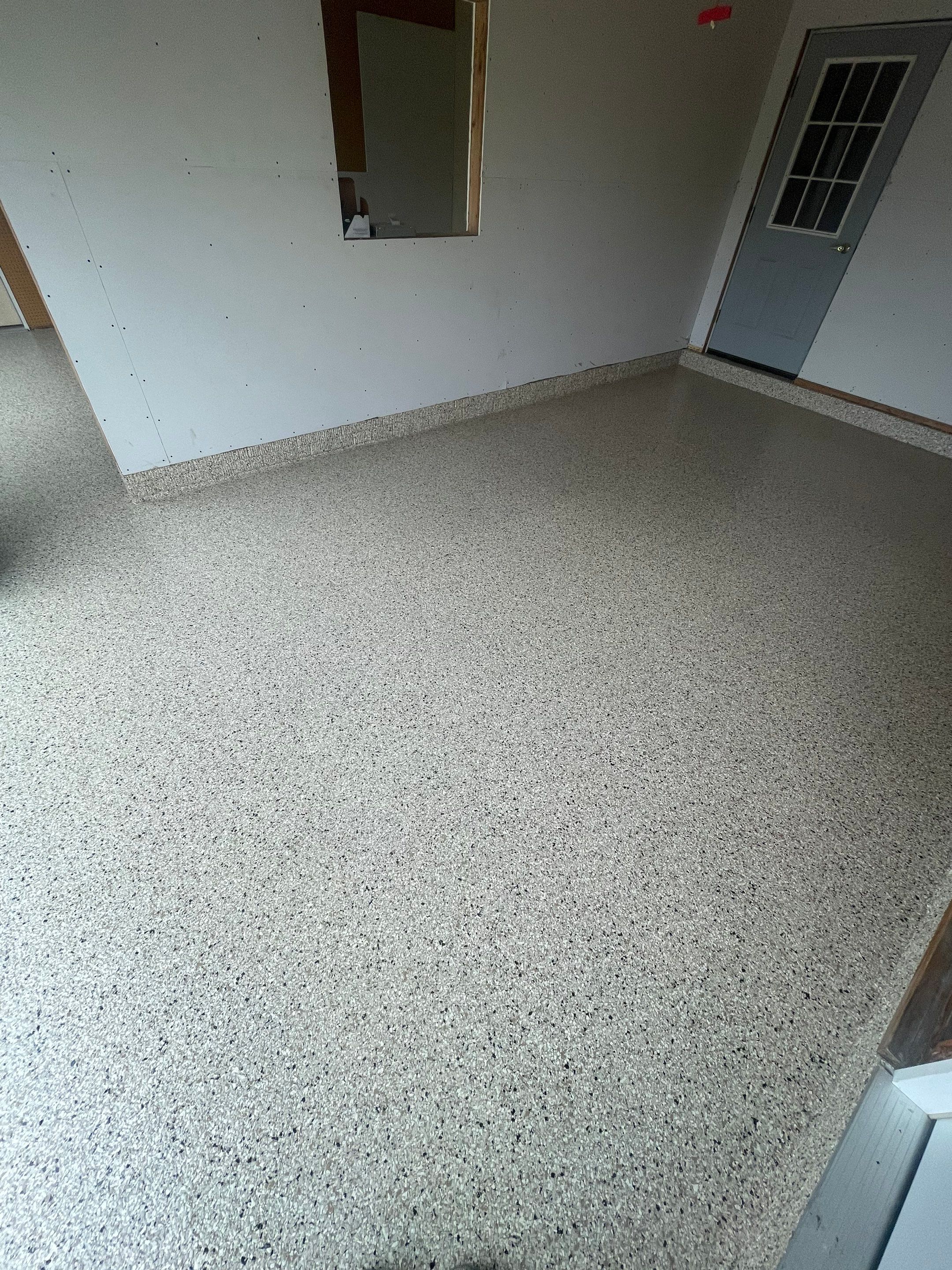 Speckled Epoxy Floor Coating Installation for Centerville Residential Garage by Select Painting, Coatings & Garage Cabinets