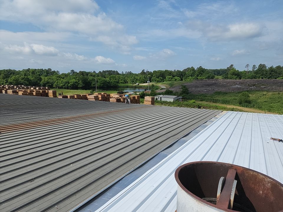 Commercial Roofing Installation using Aluminum Roofing panels by Hostetler Roofing
