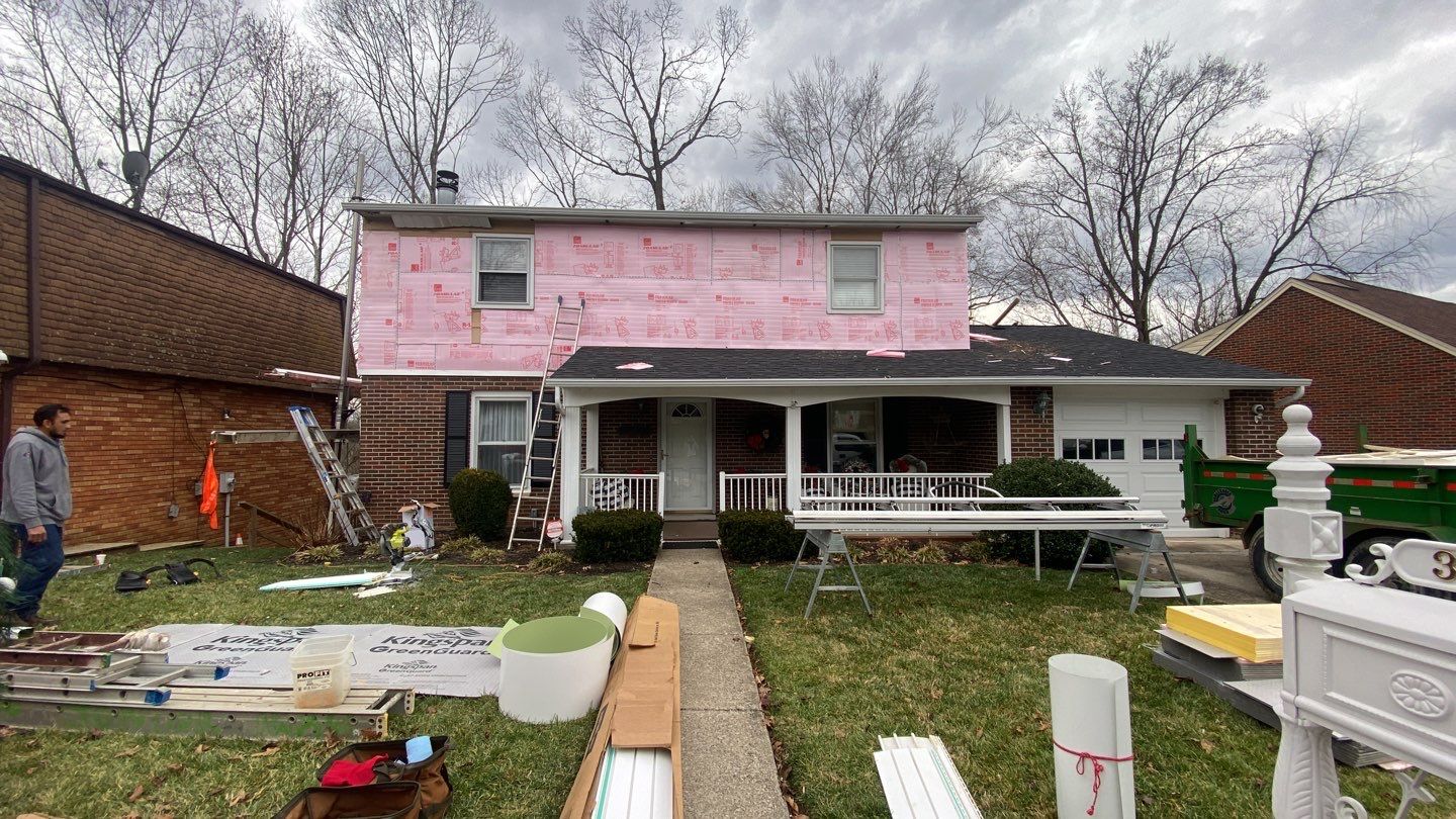 Replace dated vinyl siding with new white exterior Portfolio vinyl siding  by Secure Construction Company Inc