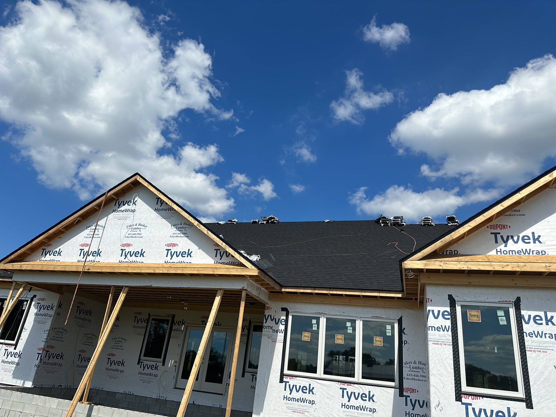 Residential Roofing Installation using Tamko Heritage AR with Standing Seam Metal Porch by Undersun Roofing 