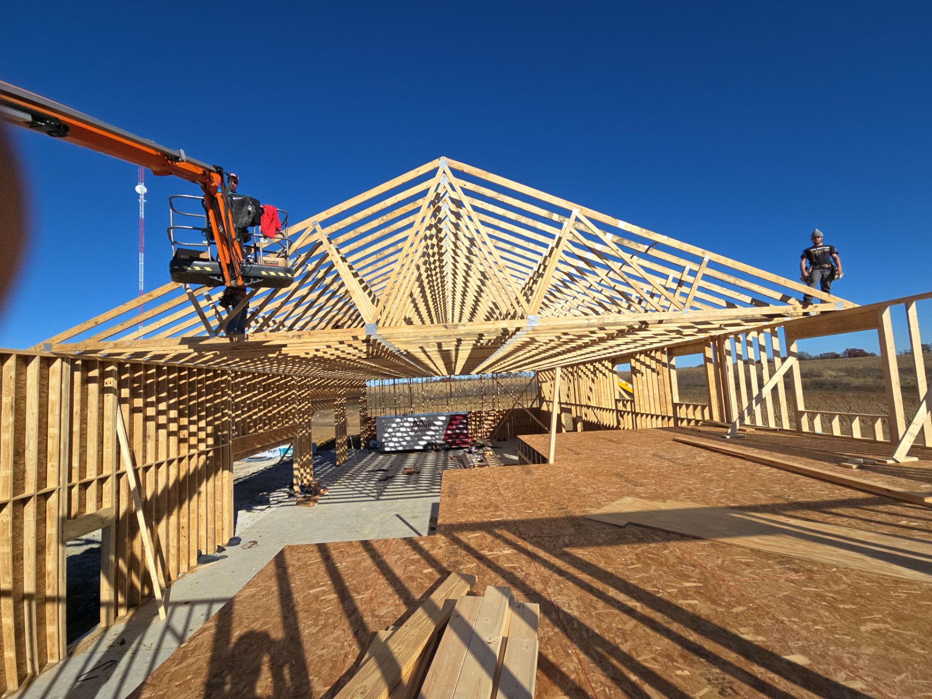 New Home construction w/ board and batten sides and metal roof  by Miles Construction 