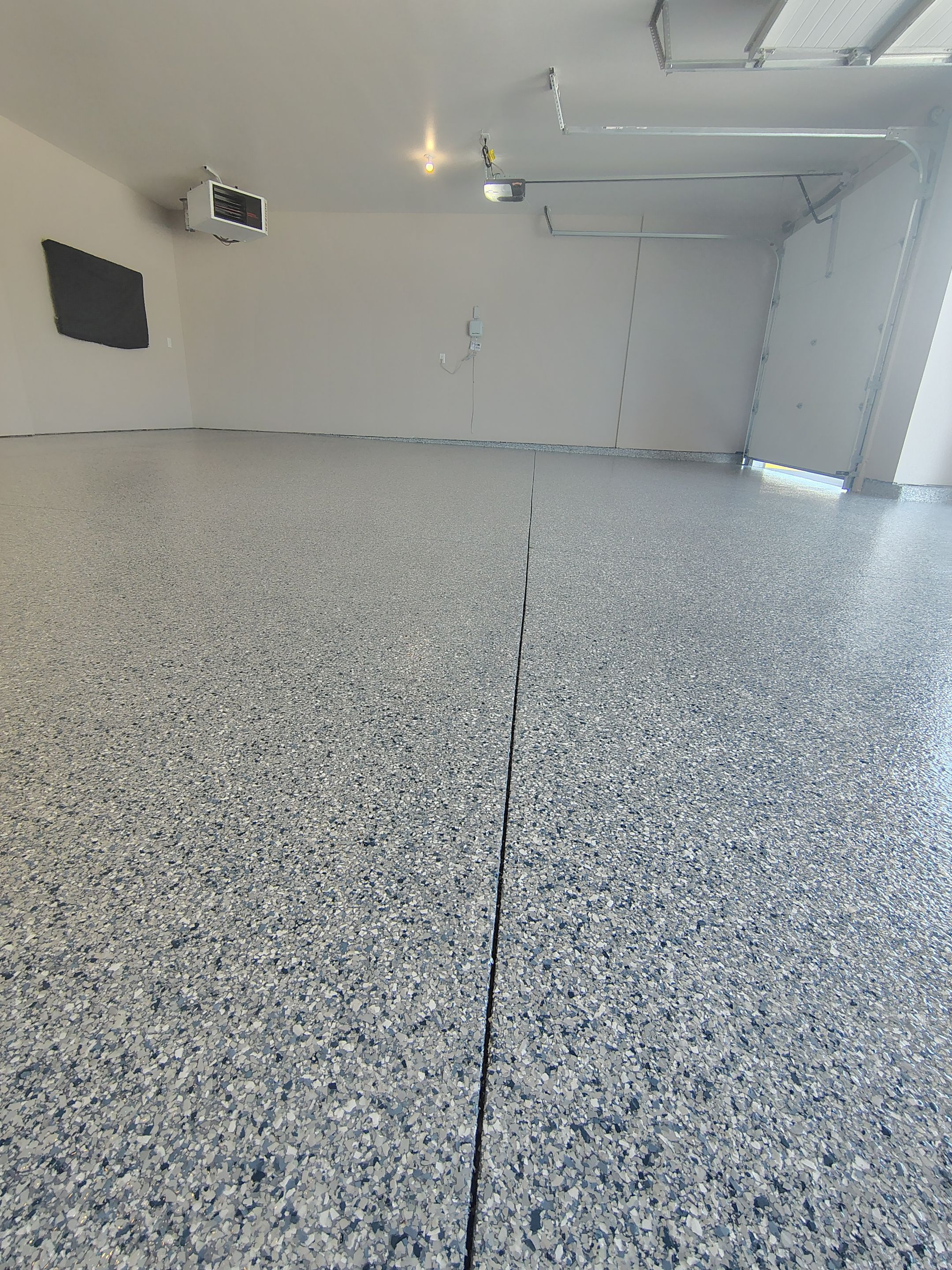 Full Speckled Concrete Coating for Sioux Falls Garage